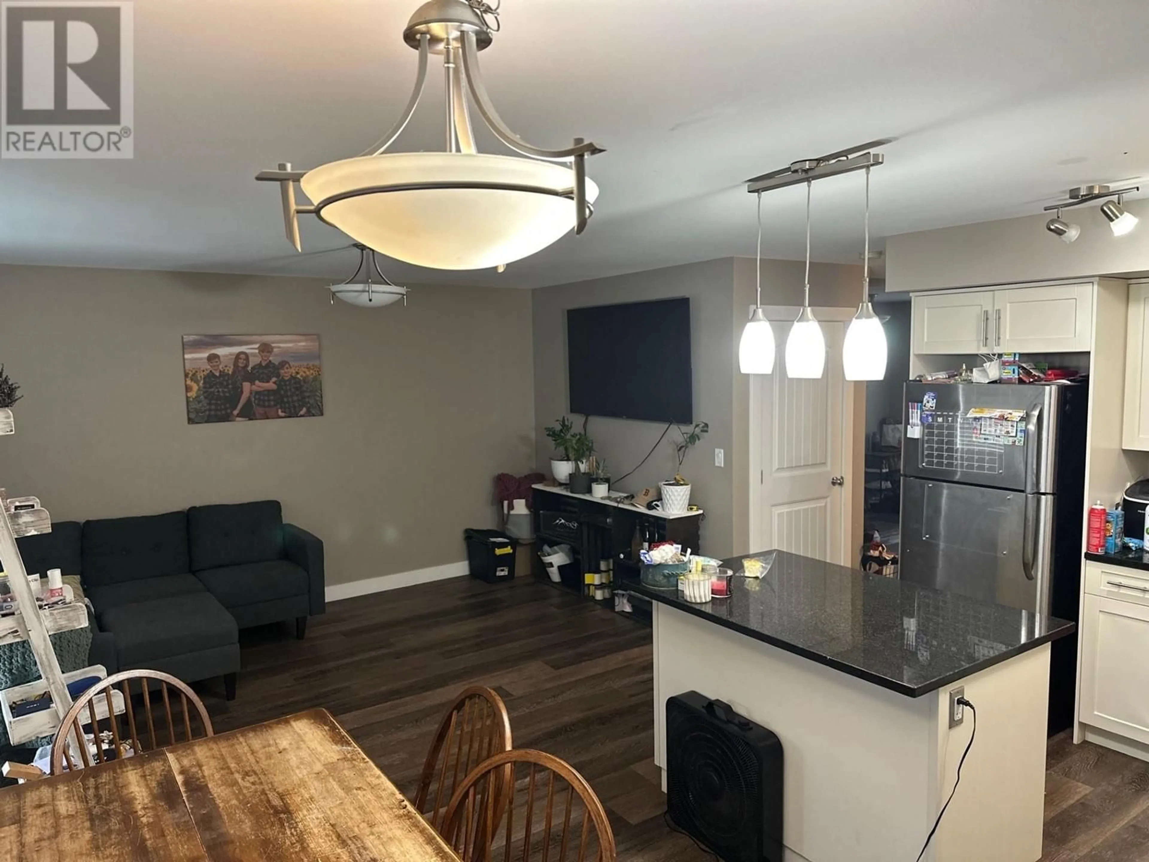 Open concept kitchen, wood/laminate floor for 138 - 10104 114A AVENUE, Fort St. John British Columbia V1J8K6