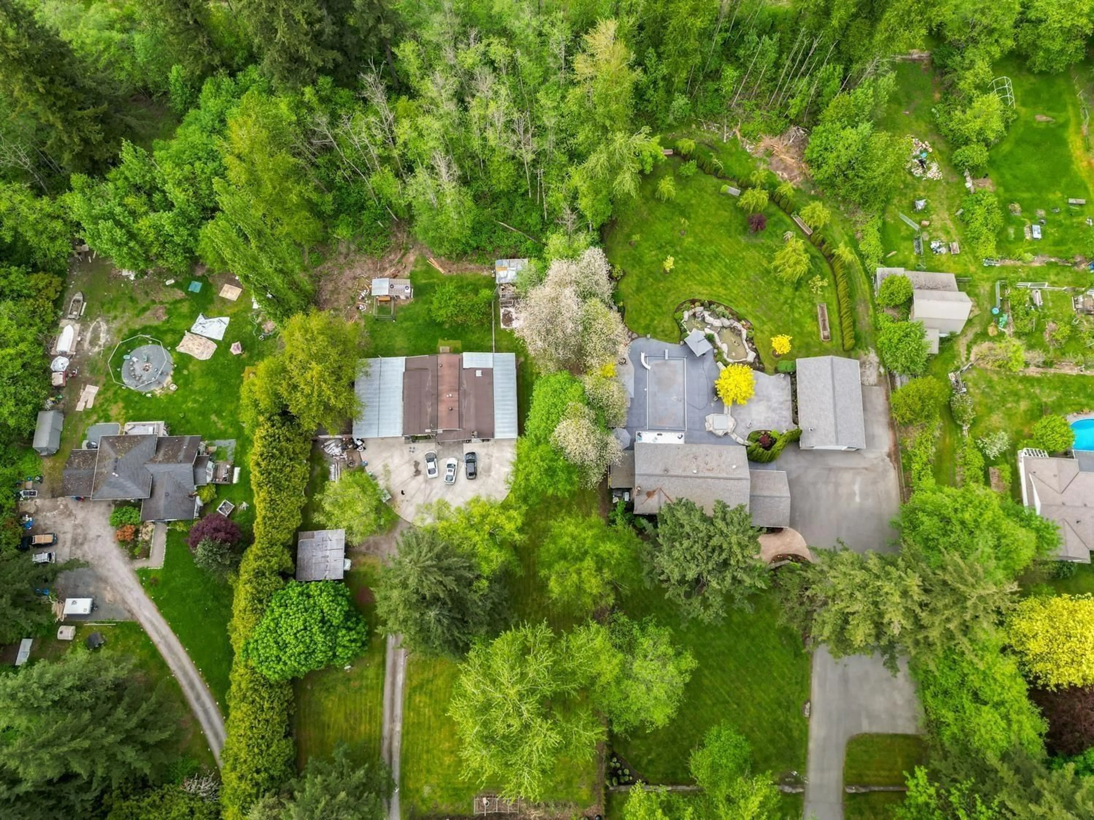 A pic from outside/outdoor area/front of a property/back of a property/a pic from drone, forest/trees view for 18089 94 AVENUE, Surrey British Columbia V4N4A3