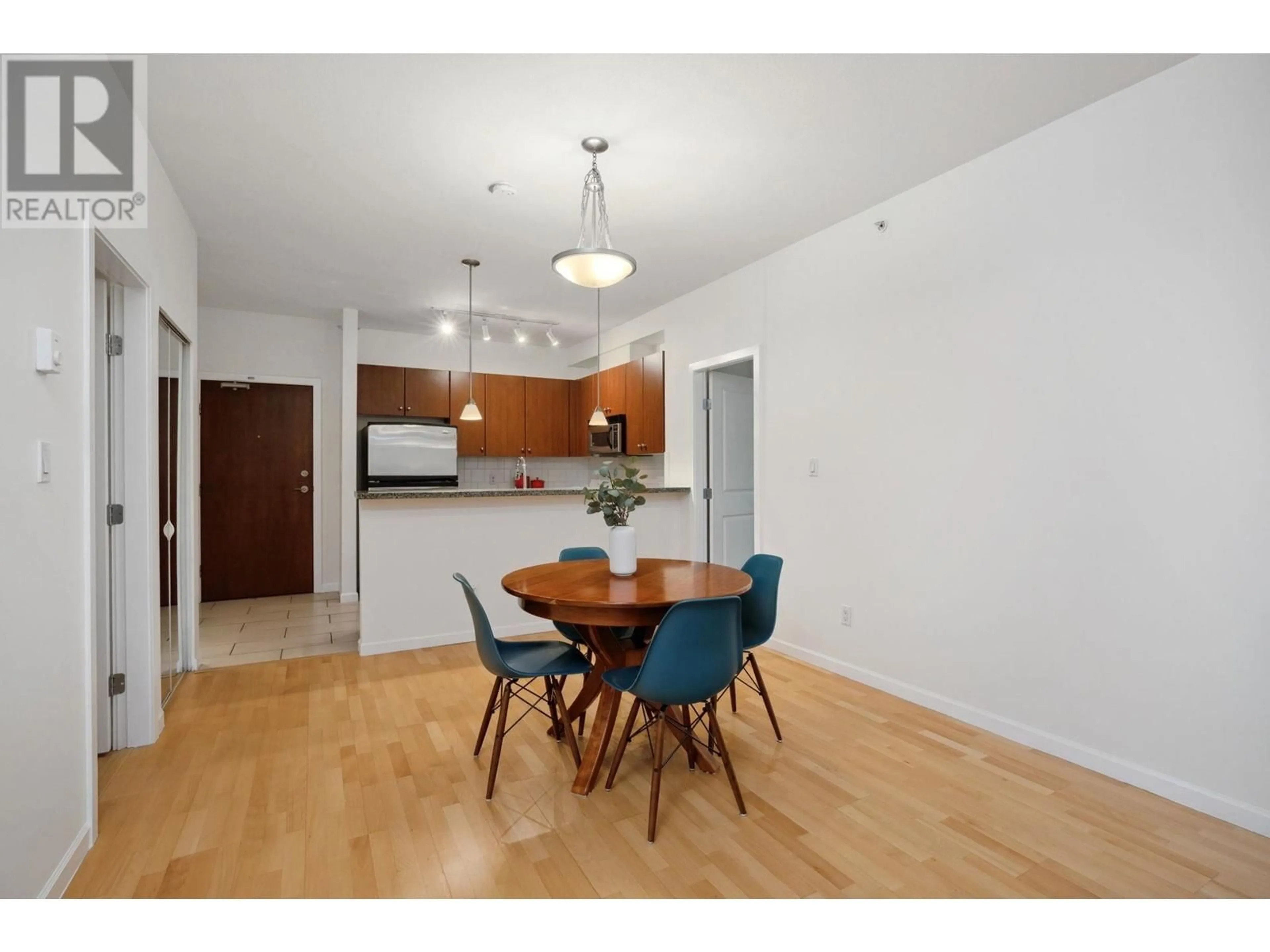 Dining room, wood/laminate floor for 413 100 CAPILANO ROAD, Port Moody British Columbia V3H5M9