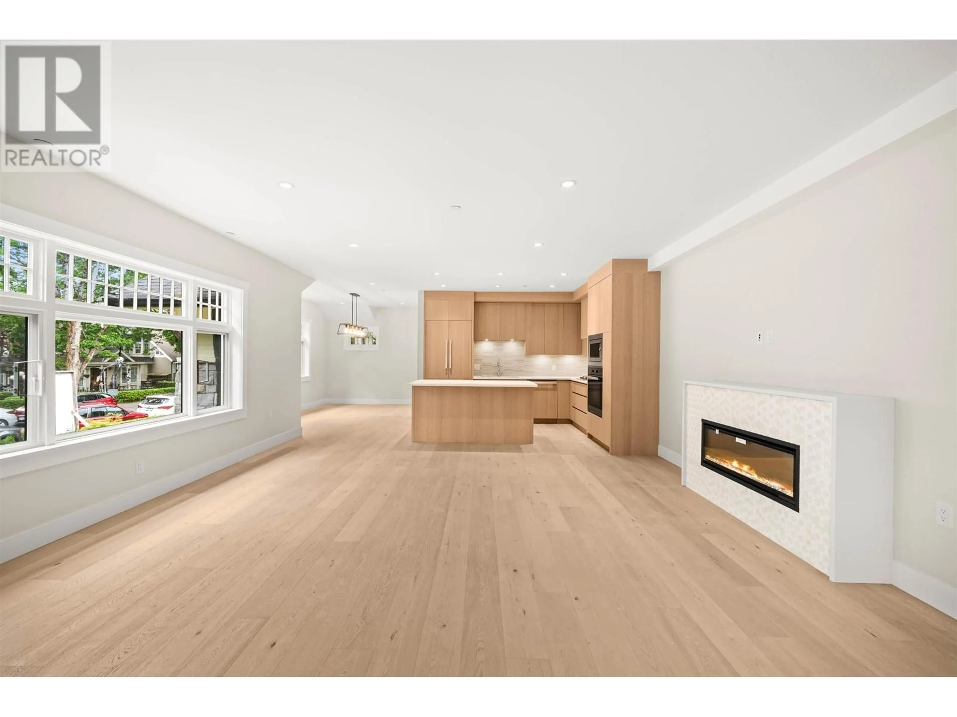 Open concept kitchen, wood/laminate floor for 1058 W 15 TH AVENUE, Vancouver British Columbia V6H1R6