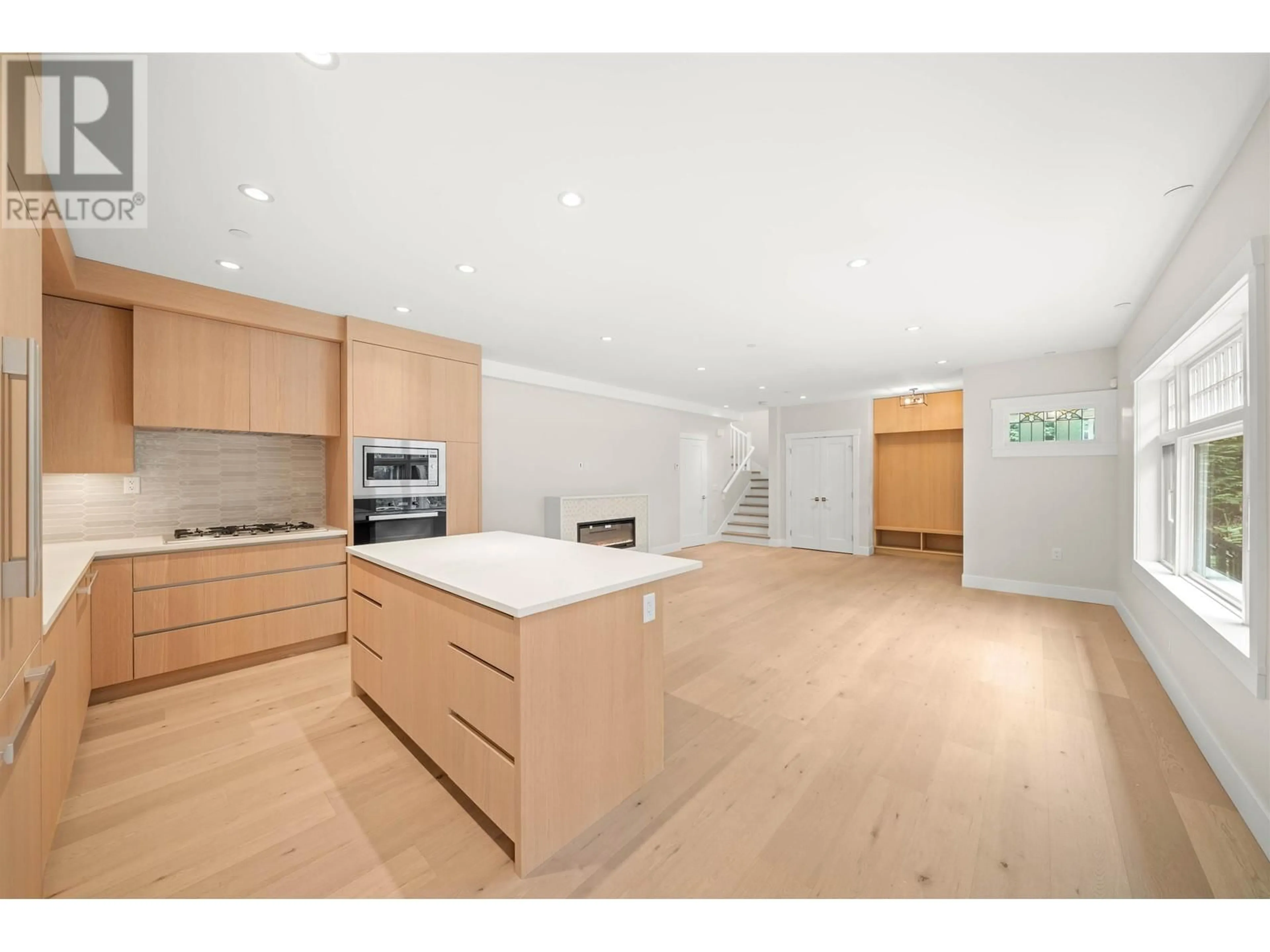 Open concept kitchen, wood/laminate floor for 1058 W 15 TH AVENUE, Vancouver British Columbia V6H1R6