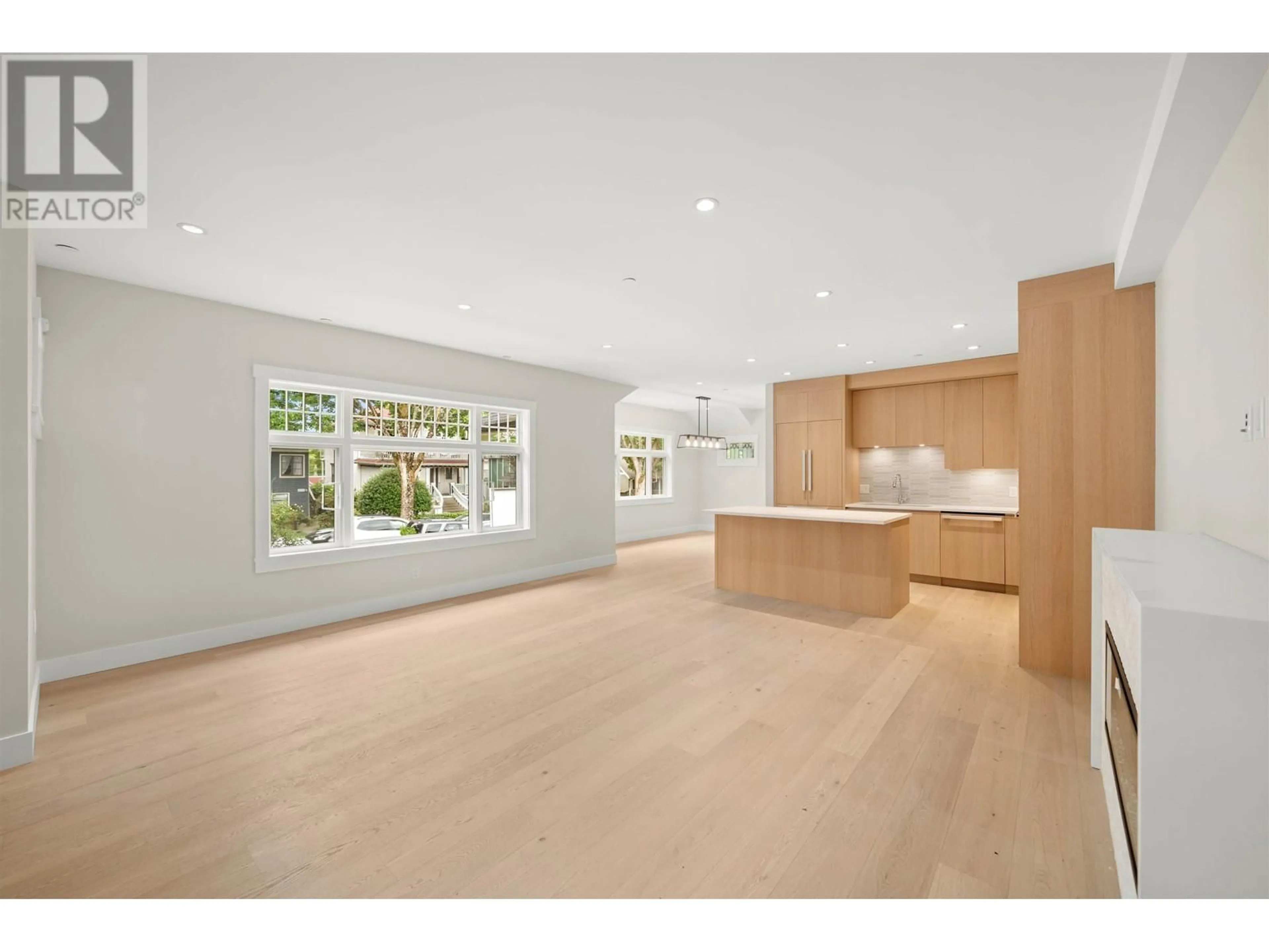 Open concept kitchen, wood/laminate floor for 1058 W 15 TH AVENUE, Vancouver British Columbia V6H1R6