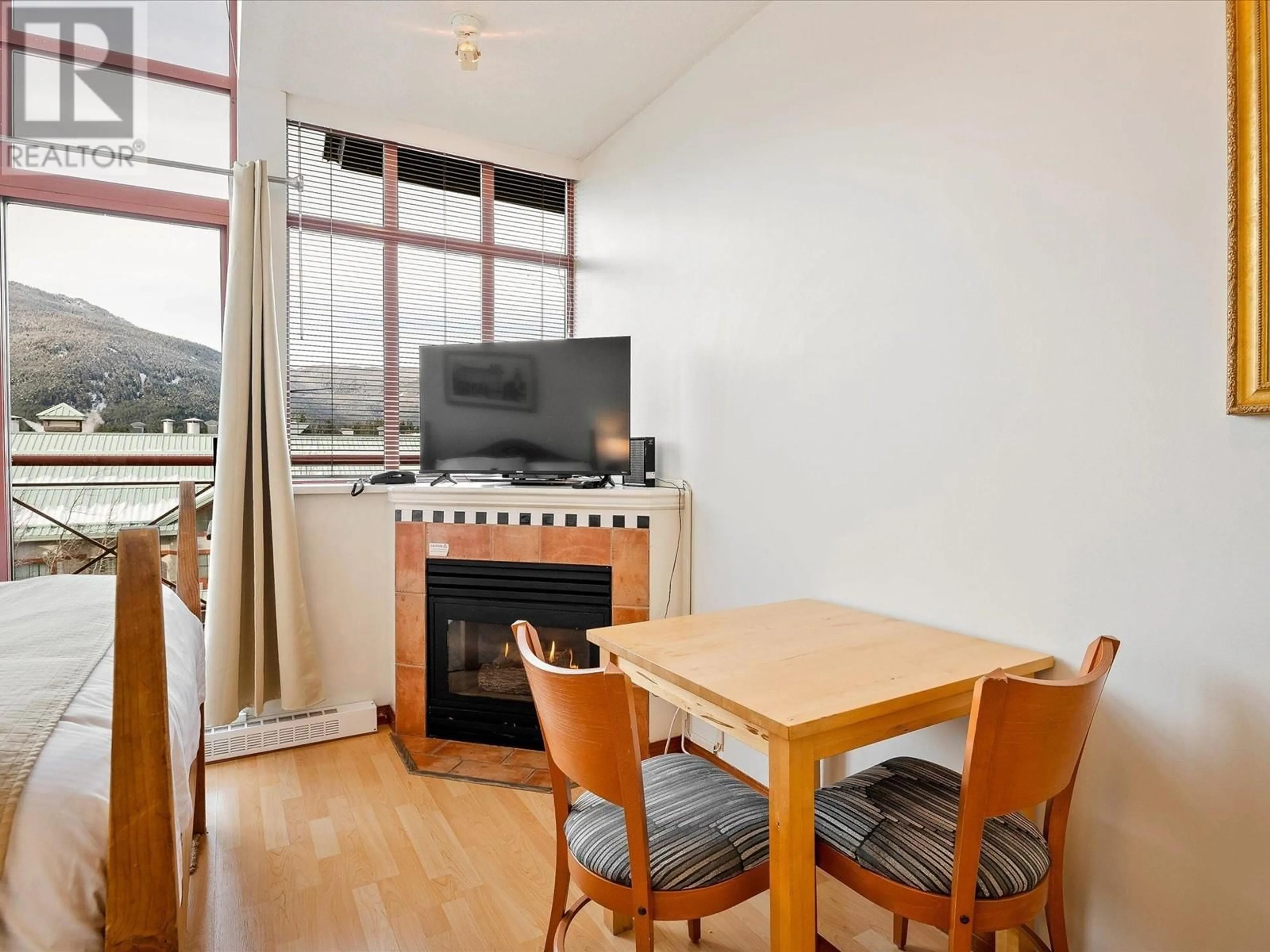 Living room with furniture, wood/laminate floor for 510 - 4369 MAIN STREET, Whistler British Columbia V8E1B7
