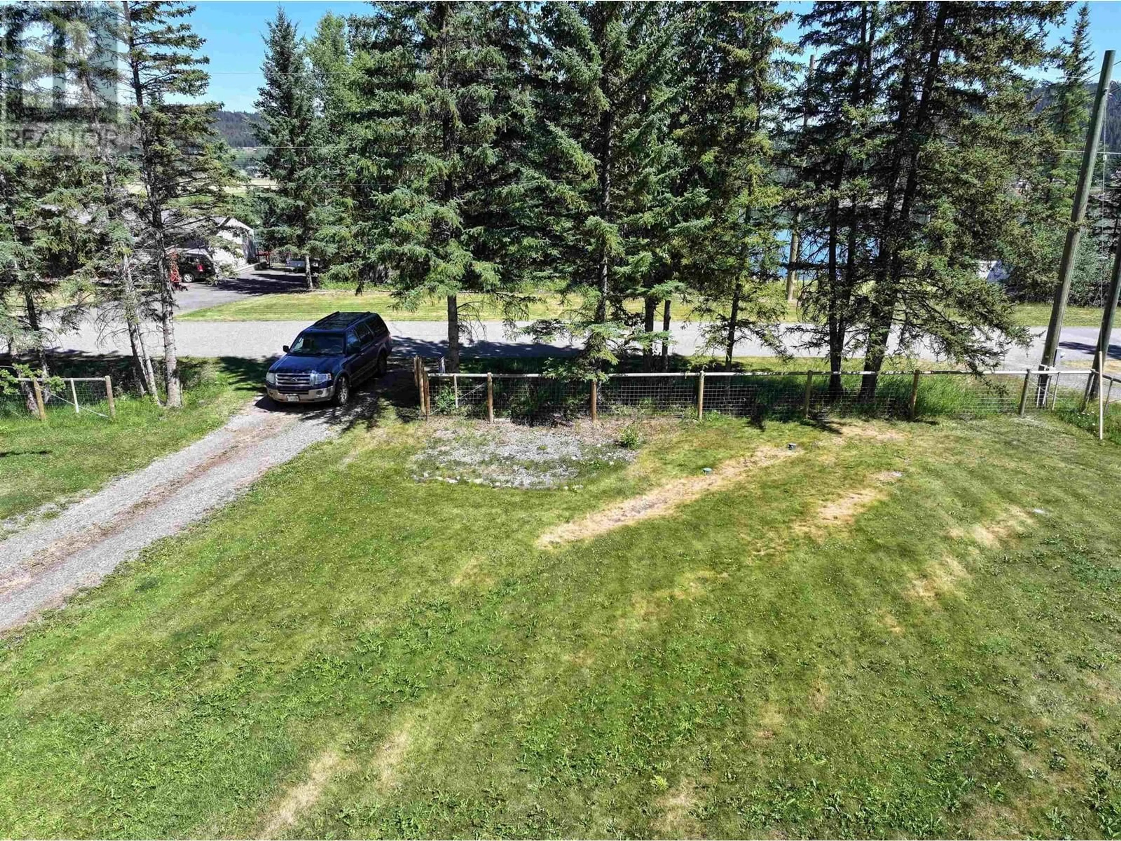 A pic from outside/outdoor area/front of a property/back of a property/a pic from drone, water/lake/river/ocean view for 6064 NORMAN ROAD, 100 Mile House British Columbia V0K2E3