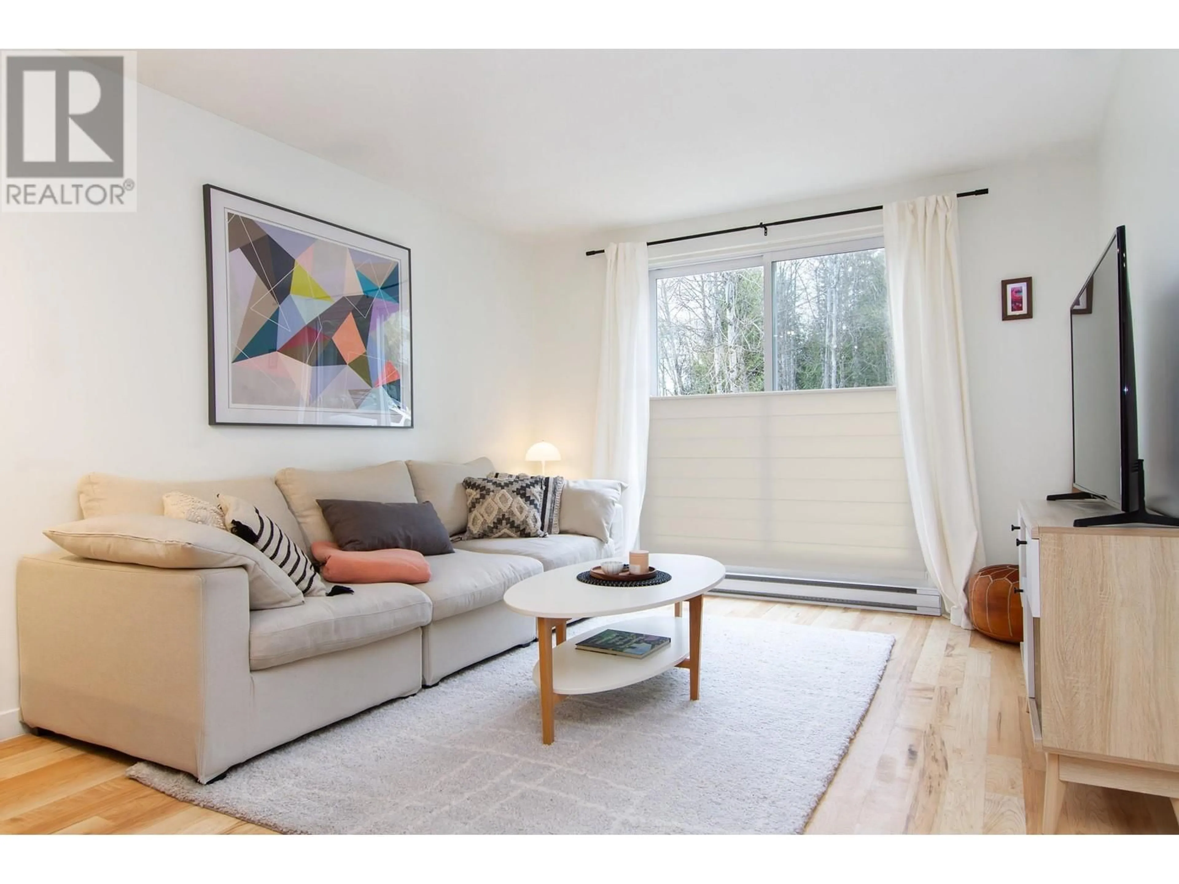 Living room with furniture, wood/laminate floor for 203 2007 NORDIC PLACE, Whistler British Columbia V8E0N9