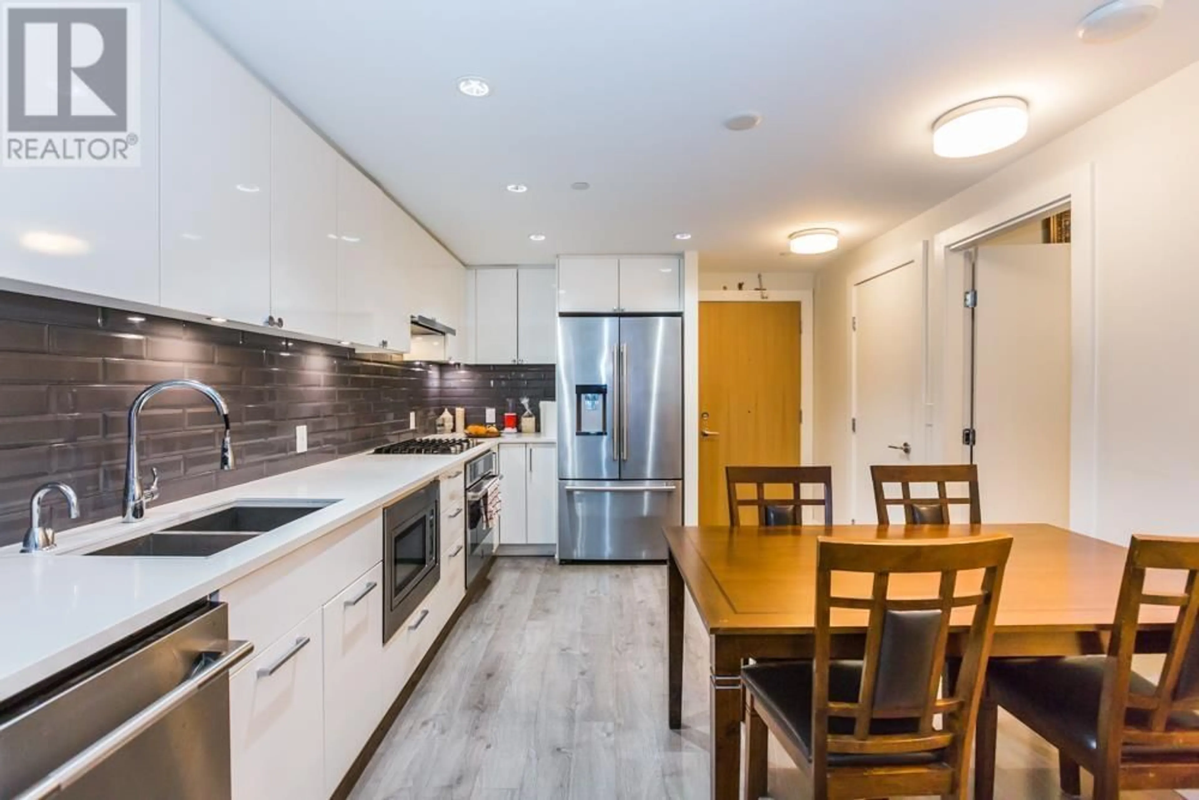 Open concept kitchen, unknown for 301 3451 SAWMILL CRESCENT, Vancouver British Columbia V5S0H3