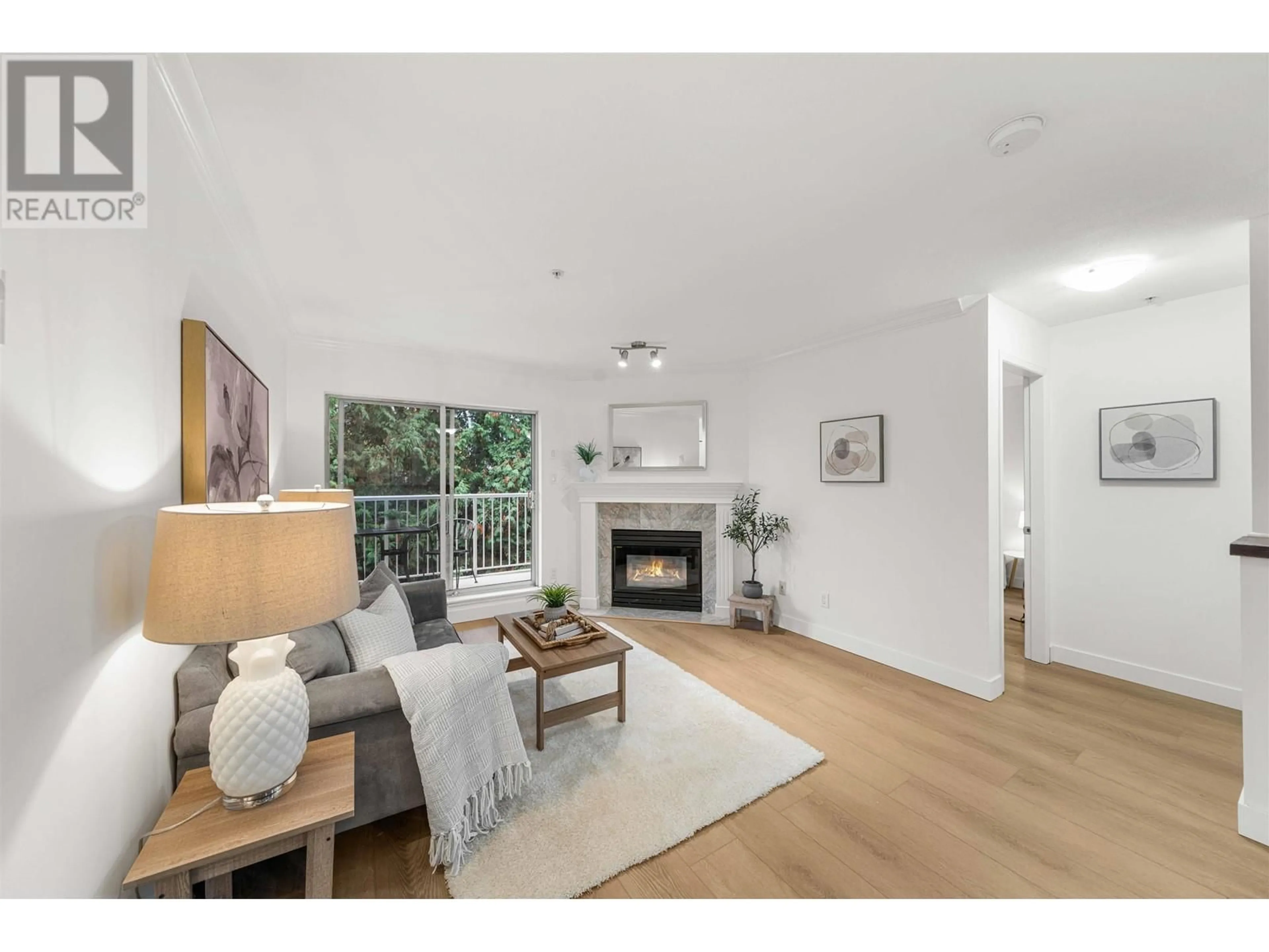 Living room with furniture, wood/laminate floor for 406 12206 224 STREET, Maple Ridge British Columbia V2X6B8