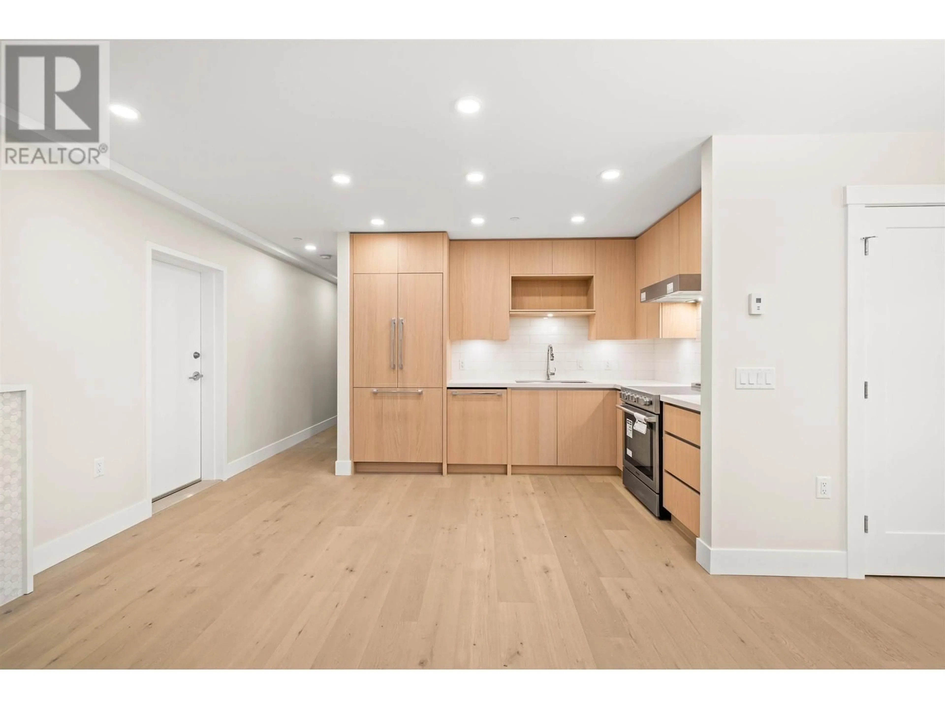 Open concept kitchen, wood/laminate floor for 1062 W 15TH AVENUE, Vancouver British Columbia V6H1R6