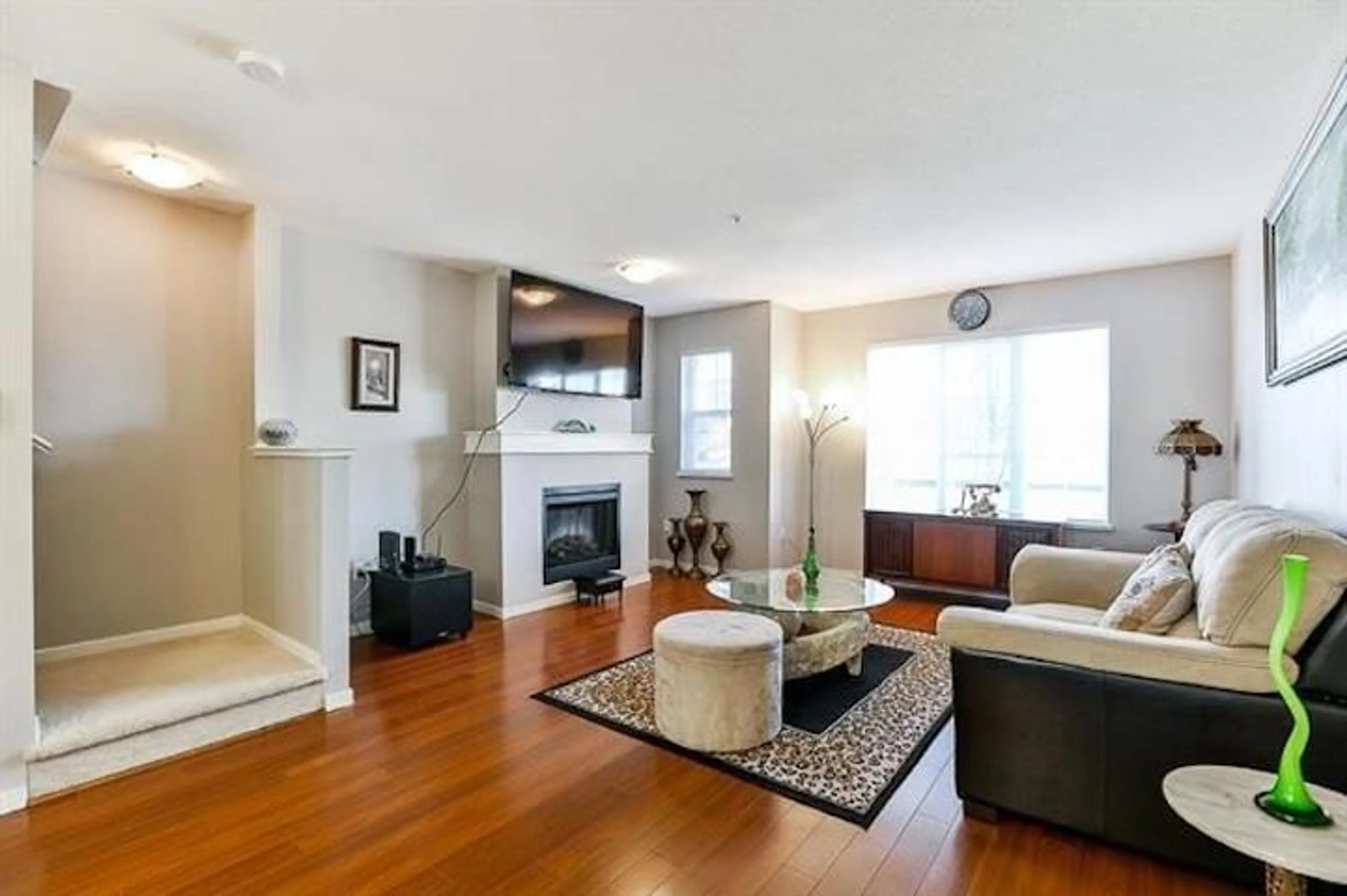 Living room with furniture, wood/laminate floor for 25 20875 80 AVENUE, Langley British Columbia V2Y0B2