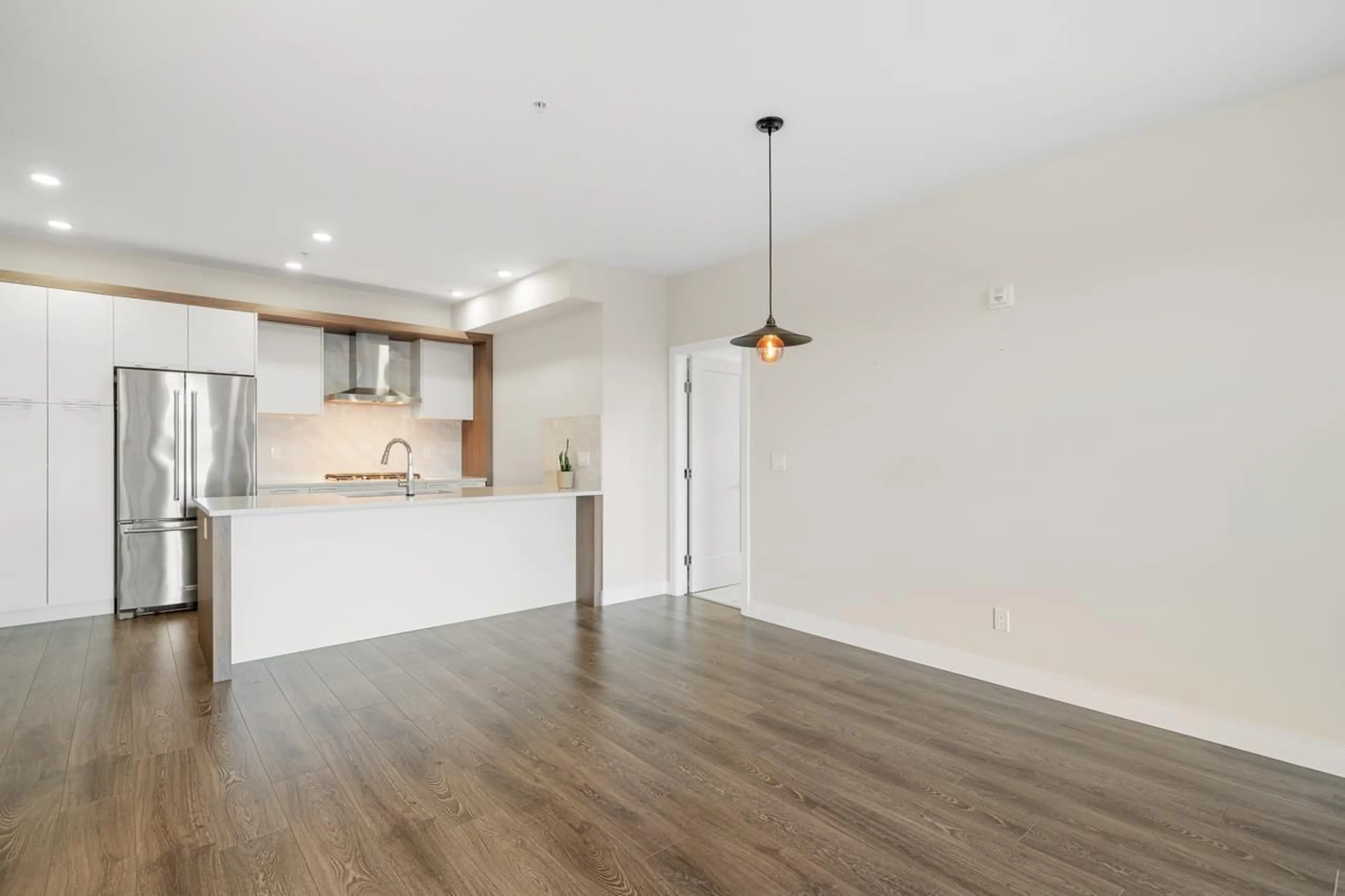 Open concept kitchen, wood/laminate floor for 508 11501 84 AVENUE, Delta British Columbia V4C0E5