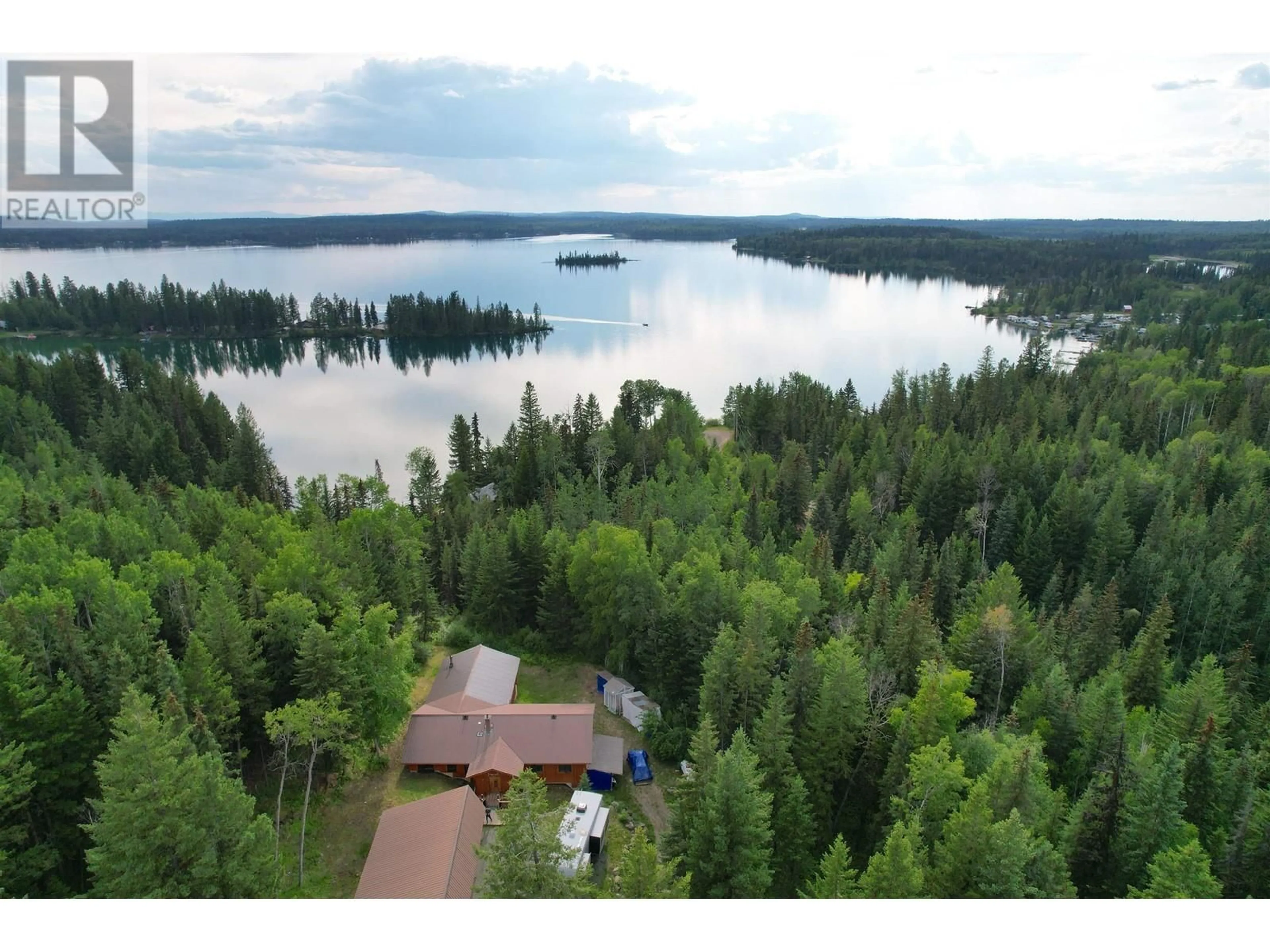 A pic from outside/outdoor area/front of a property/back of a property/a pic from drone, water/lake/river/ocean view for 7524 THOMAS POINT ROAD, 100 Mile House British Columbia V0K1X1