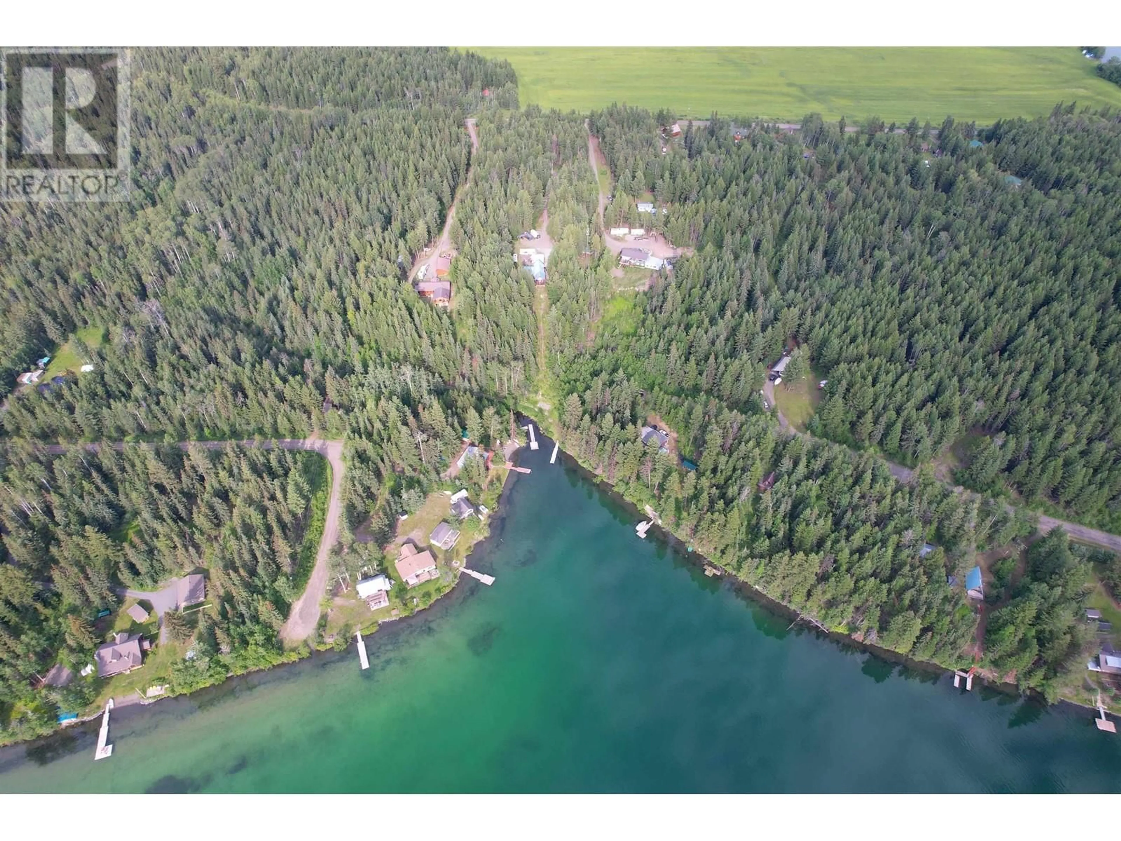 A pic from outside/outdoor area/front of a property/back of a property/a pic from drone, water/lake/river/ocean view for 7524 THOMAS POINT ROAD, 100 Mile House British Columbia V0K1X1