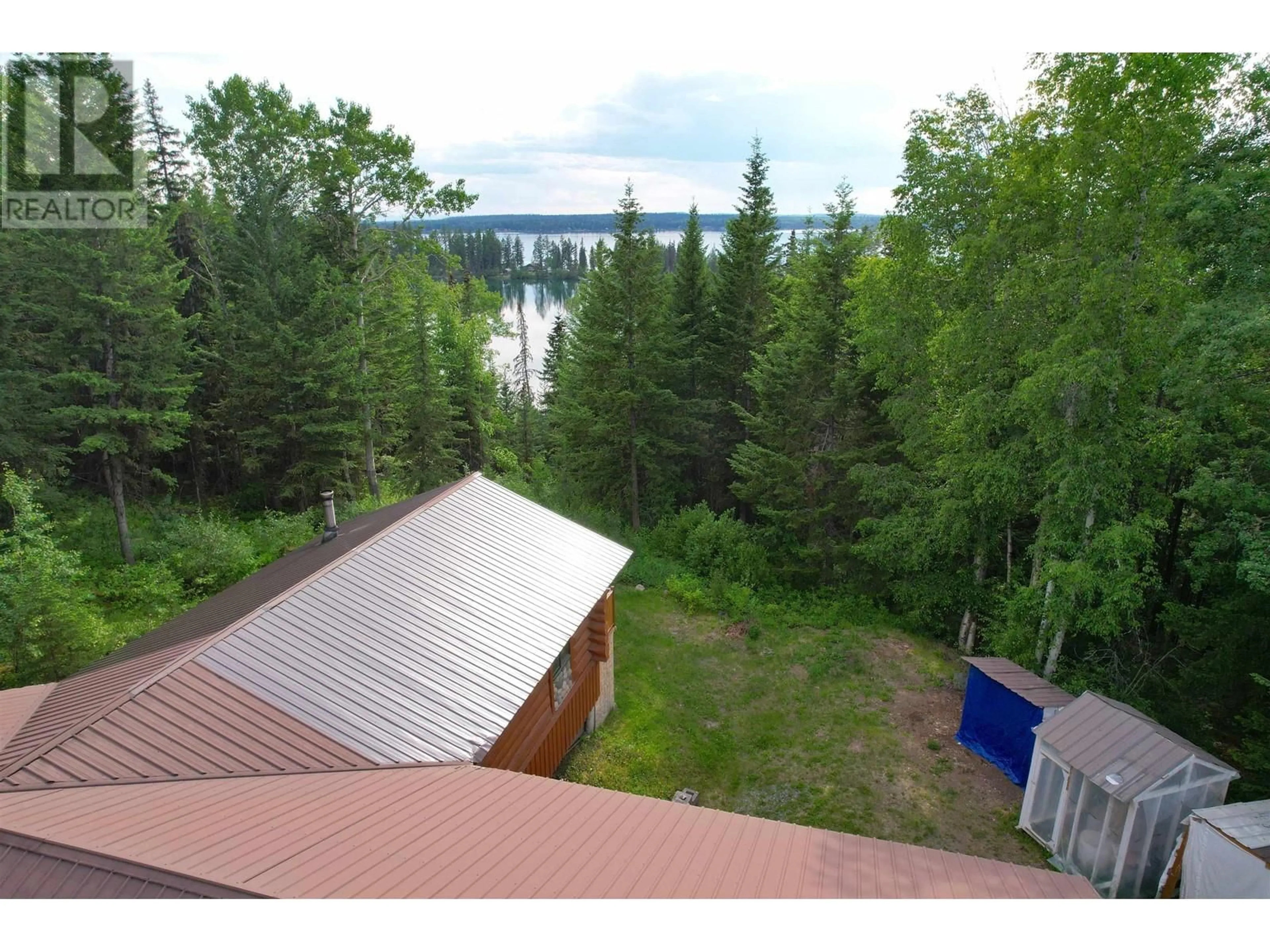 A pic from outside/outdoor area/front of a property/back of a property/a pic from drone, water/lake/river/ocean view for 7524 THOMAS POINT ROAD, 100 Mile House British Columbia V0K1X1