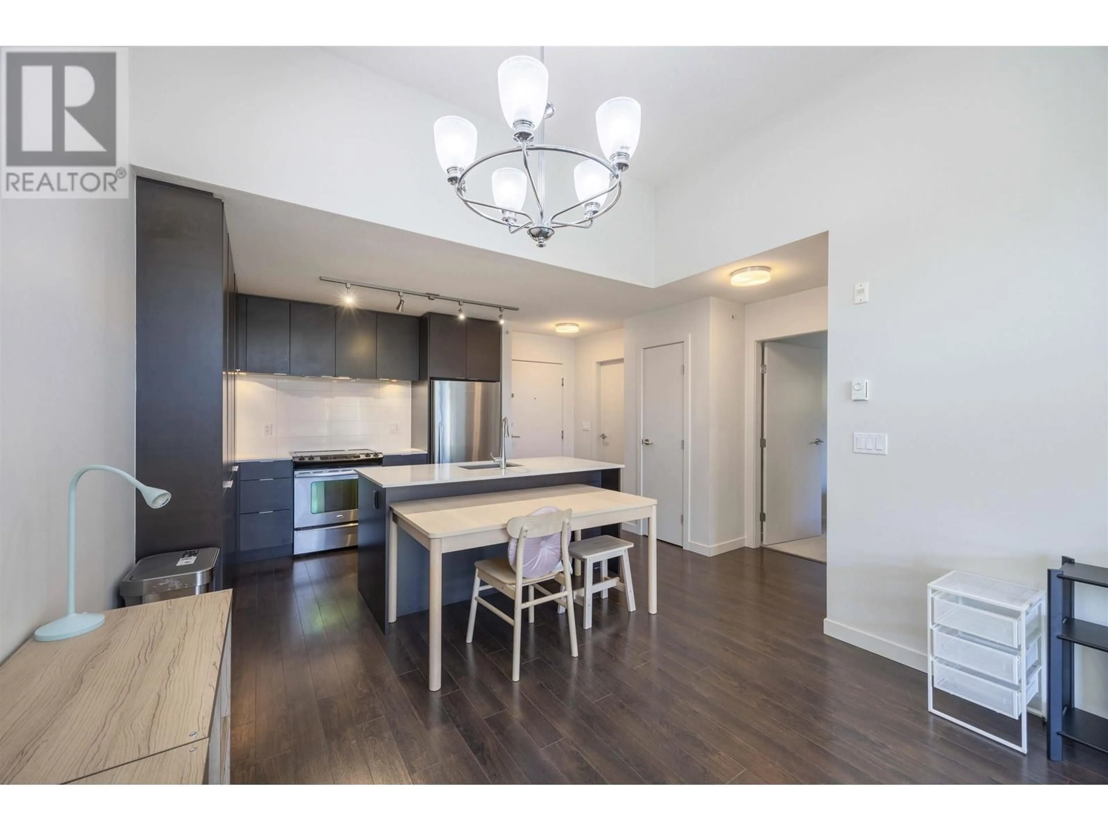 Open concept kitchen, wood/laminate floor for 509 1677 LLOYD AVENUE, Vancouver British Columbia V7P0B1