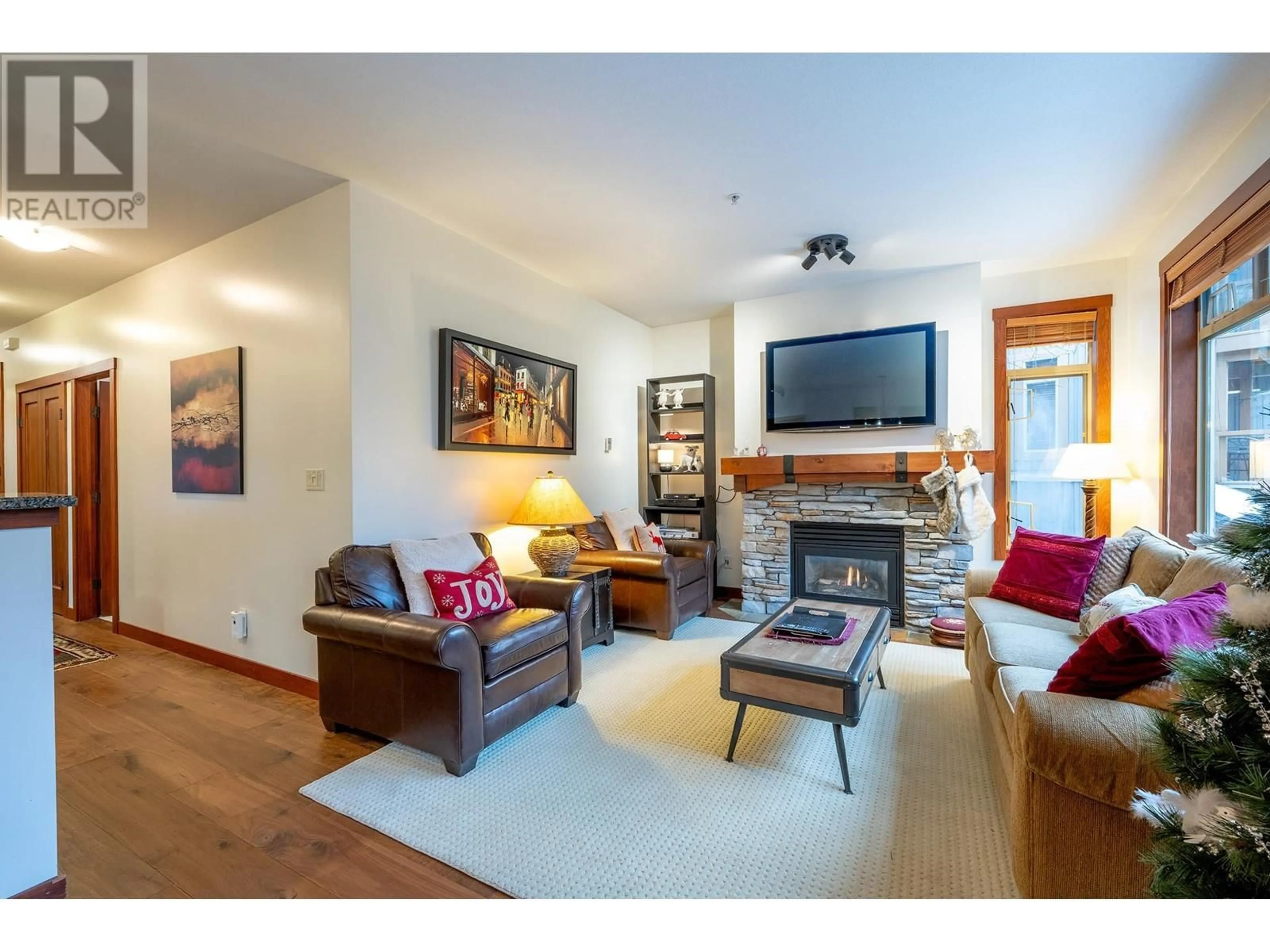 Living room with furniture, wood/laminate floor for 25 2301 TALUSWOOD PLACE, Whistler British Columbia V8E0P8