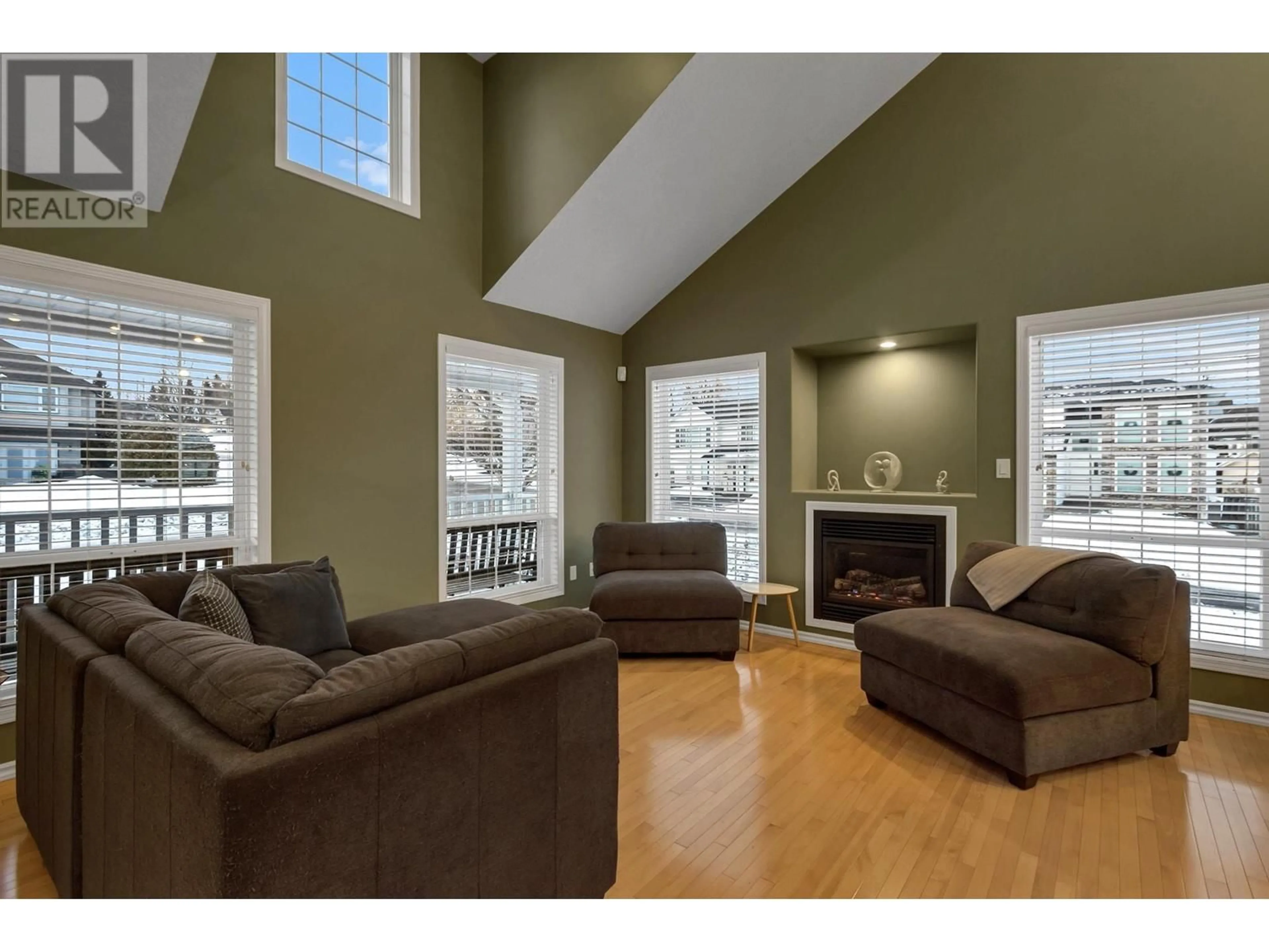 Living room with furniture, wood/laminate floor for 7124 ST GERALD PLACE, Prince George British Columbia V2N4Y3