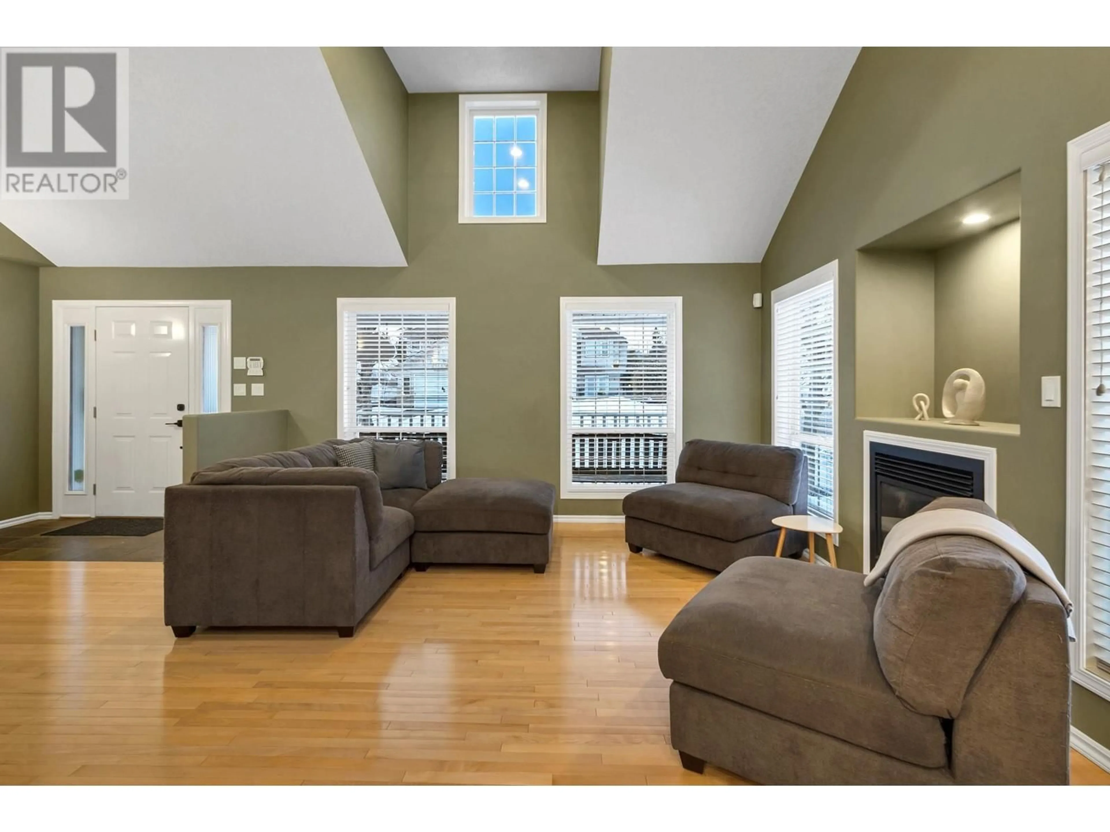 Living room with furniture, wood/laminate floor for 7124 ST GERALD PLACE, Prince George British Columbia V2N4Y3