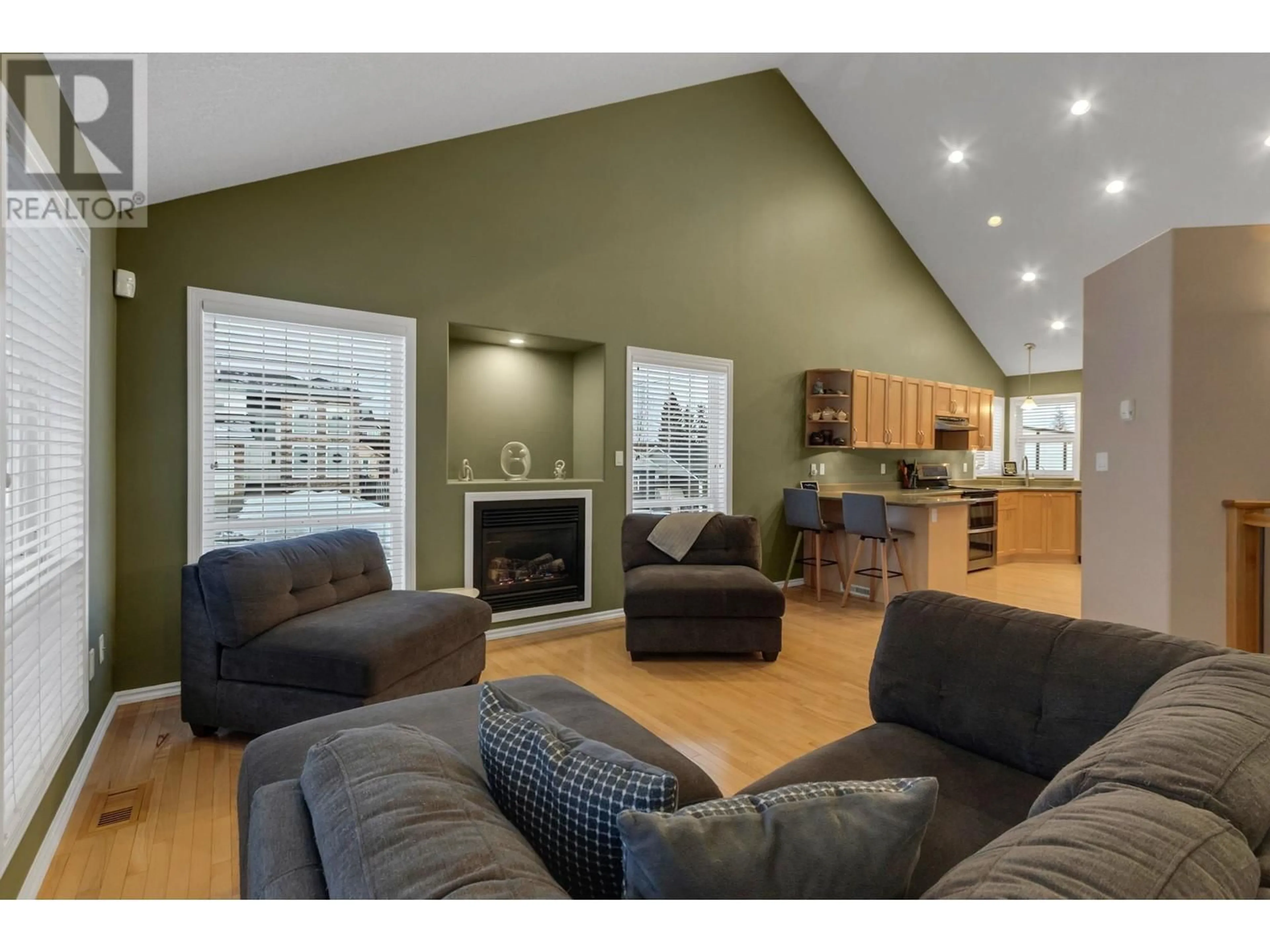 Living room with furniture, wood/laminate floor for 7124 ST GERALD PLACE, Prince George British Columbia V2N4Y3