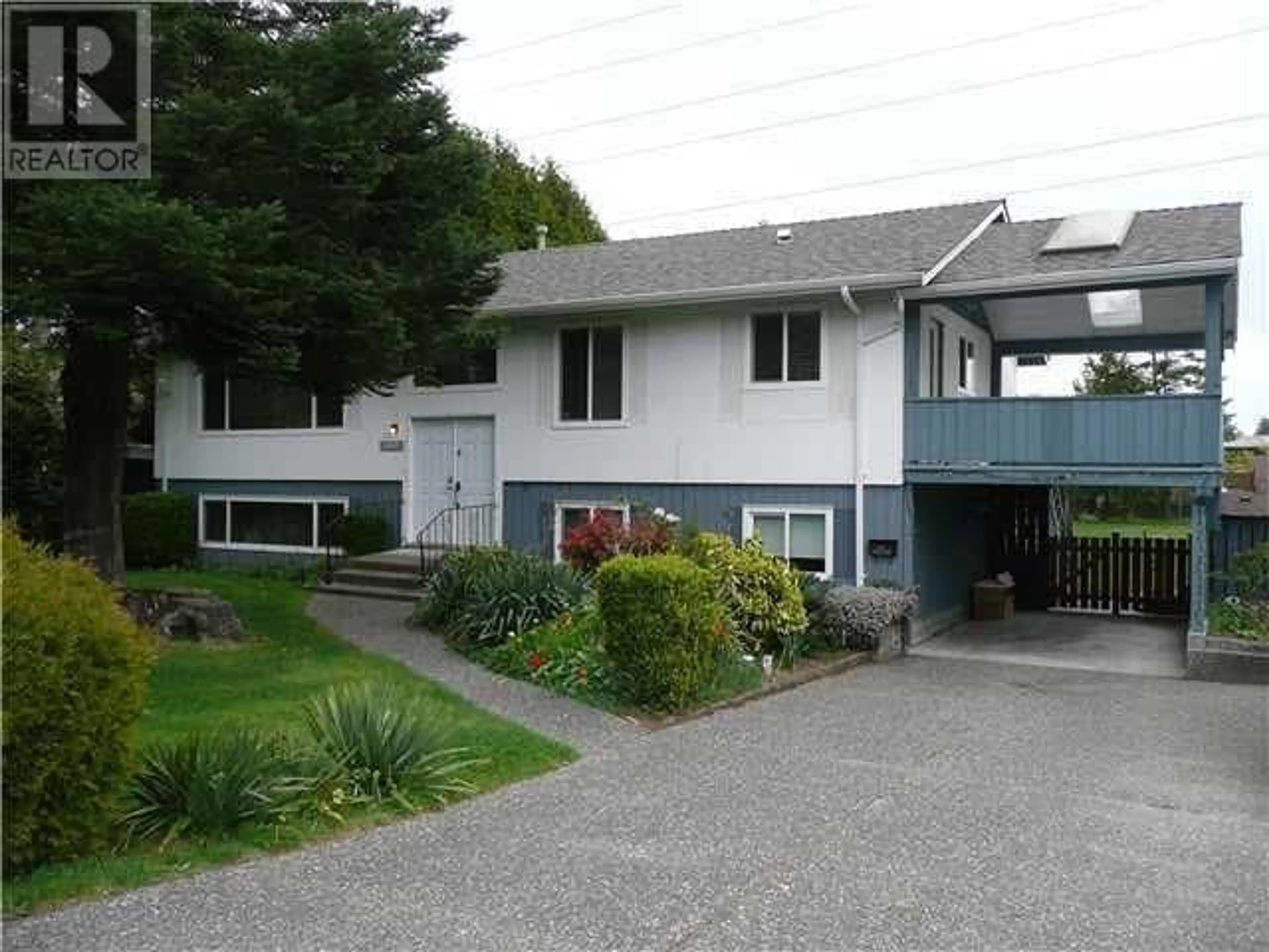 Home with vinyl exterior material, street for 1022 53A STREET, Delta British Columbia V4M3C9