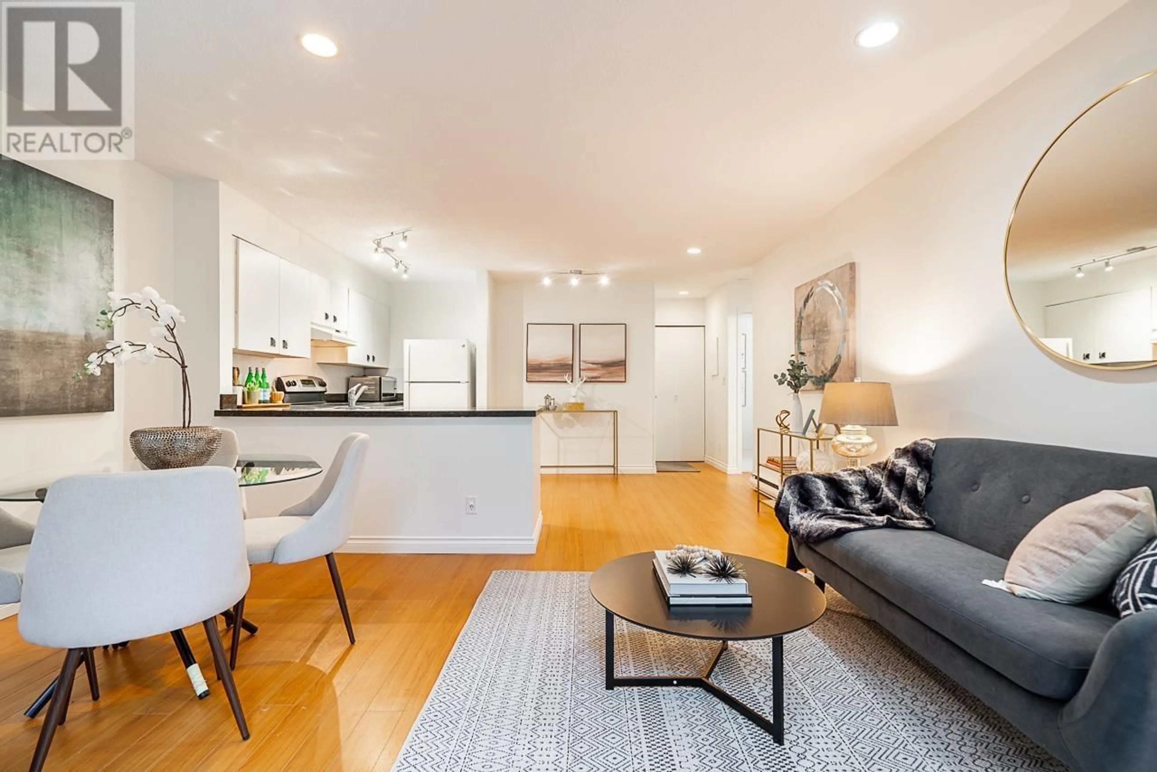 Living room with furniture, wood/laminate floor for 12 460 W 16 AVENUE, Vancouver British Columbia V5Y1Z3