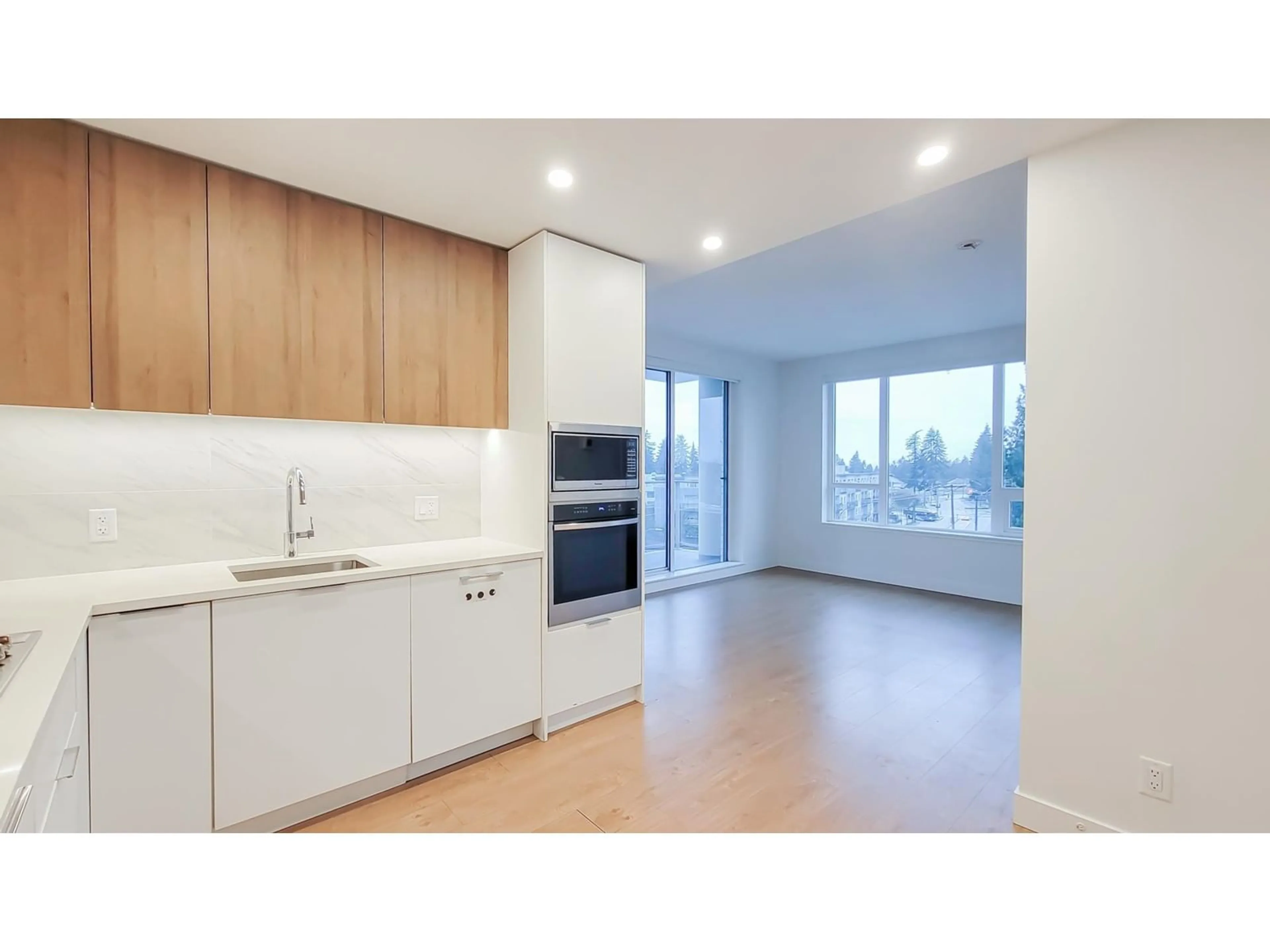 Open concept kitchen, wood/laminate floor for 507 13359 OLD YALE ROAD, Surrey British Columbia V3T0S4