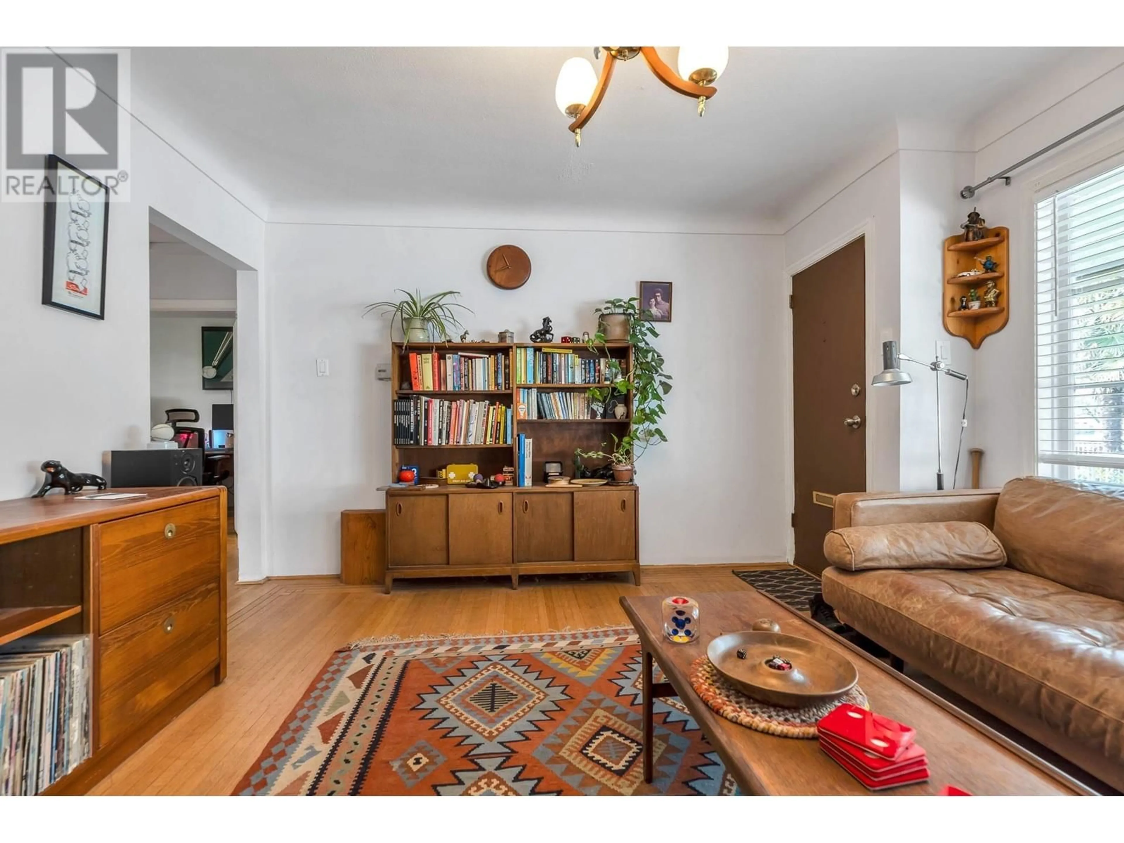 Living room with furniture, wood/laminate floor for 5050 MAIN STREET, Vancouver British Columbia V5W2R3