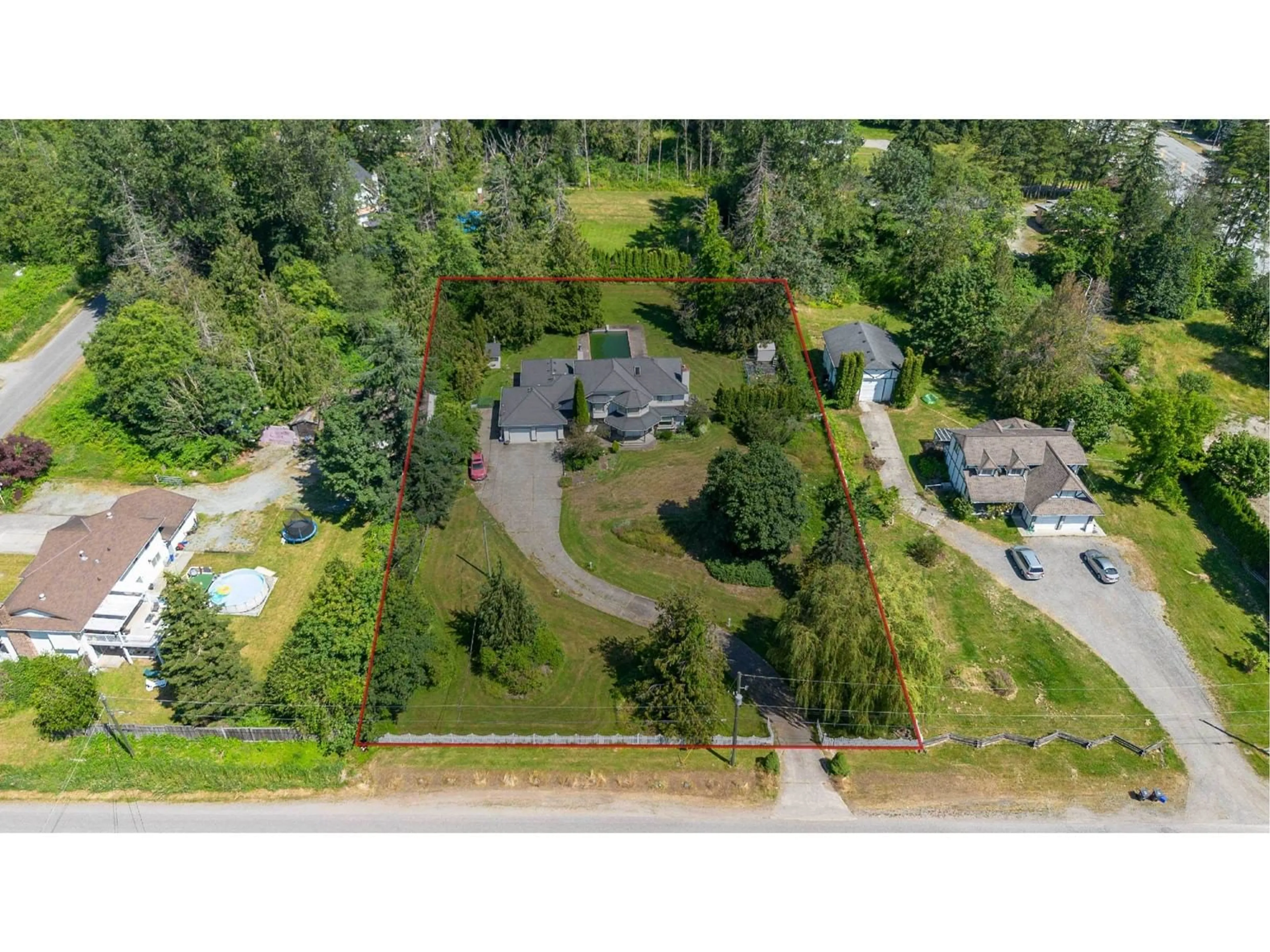 A pic from outside/outdoor area/front of a property/back of a property/a pic from drone, street for 20745 68 AVENUE, Langley British Columbia V2Y1R1