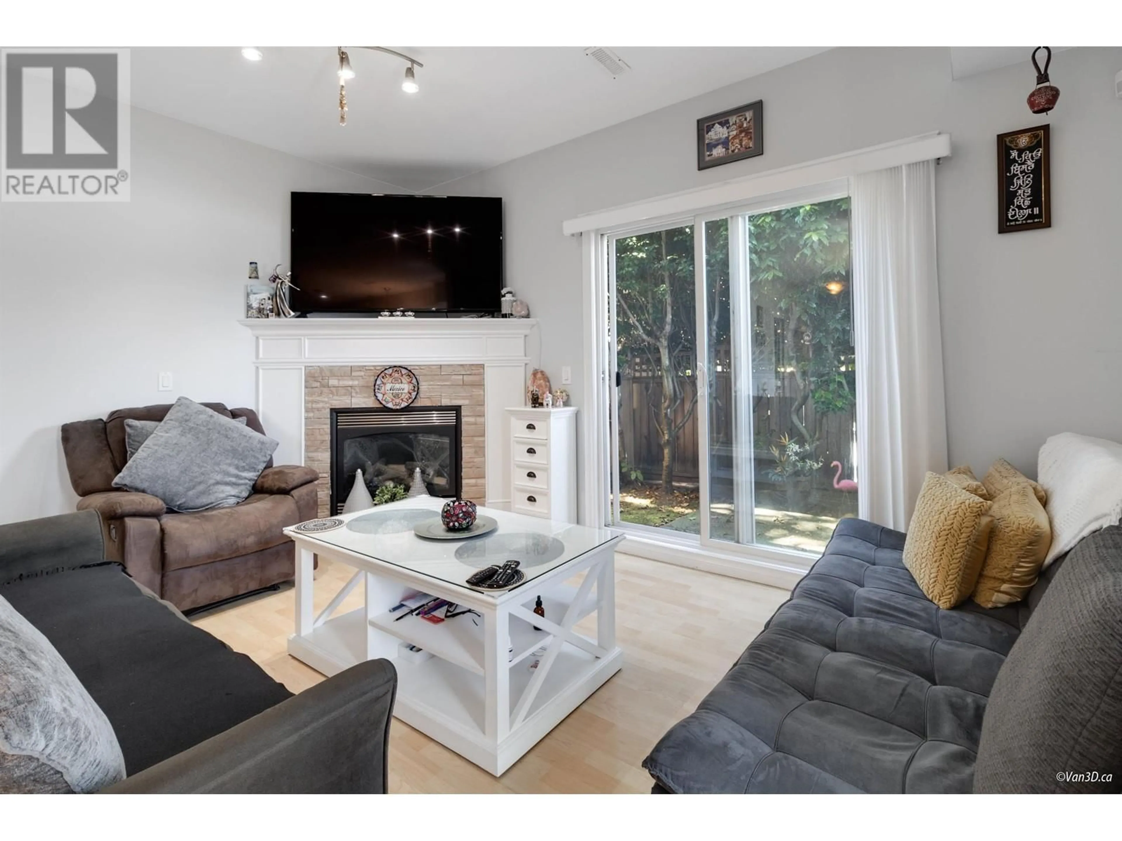 Living room with furniture, wood/laminate floor for 1 11331 CAMBIE ROAD, Richmond British Columbia V6X1L3