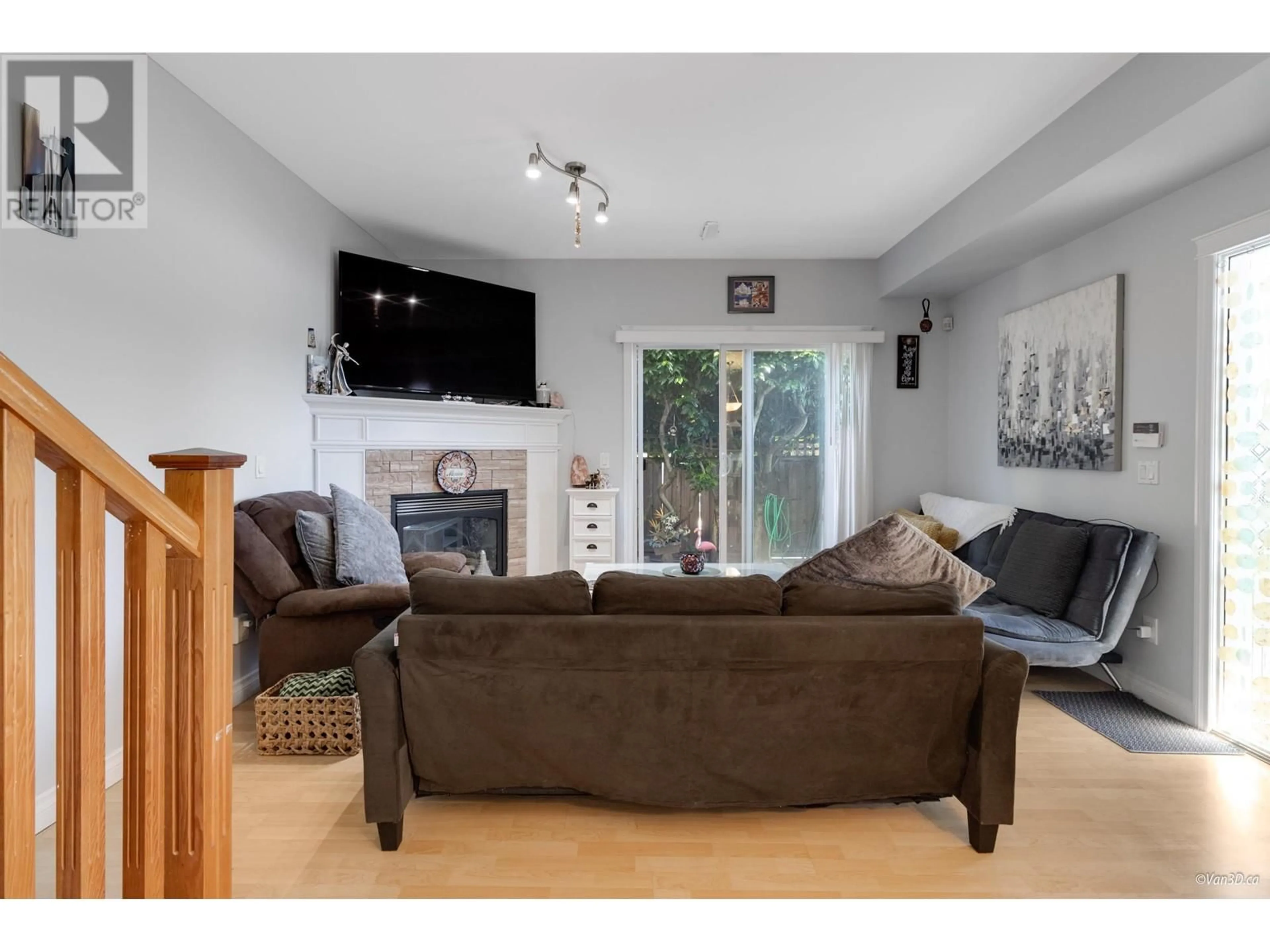 Living room with furniture, wood/laminate floor for 1 11331 CAMBIE ROAD, Richmond British Columbia V6X1L3