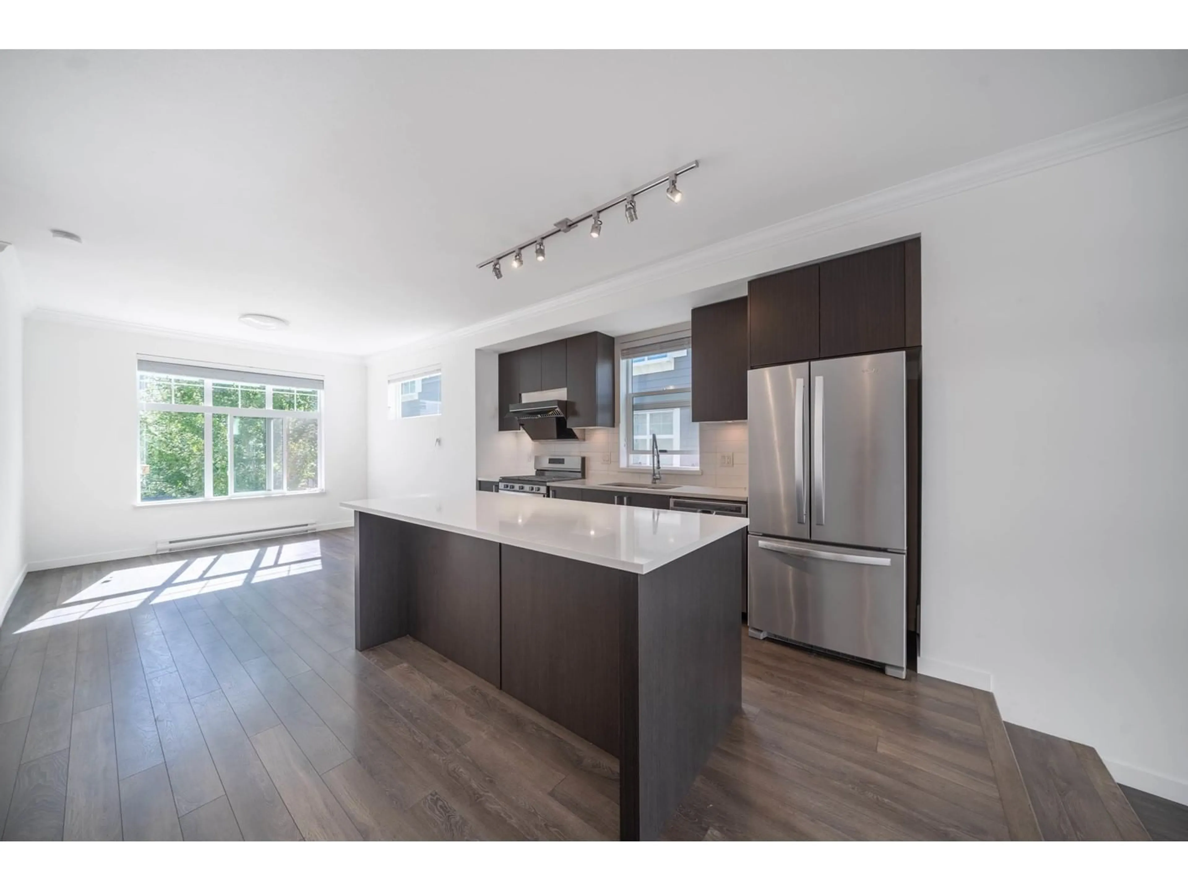 Open concept kitchen, wood/laminate floor for 67 16678 25 AVENUE, Surrey British Columbia V3Z0Z2