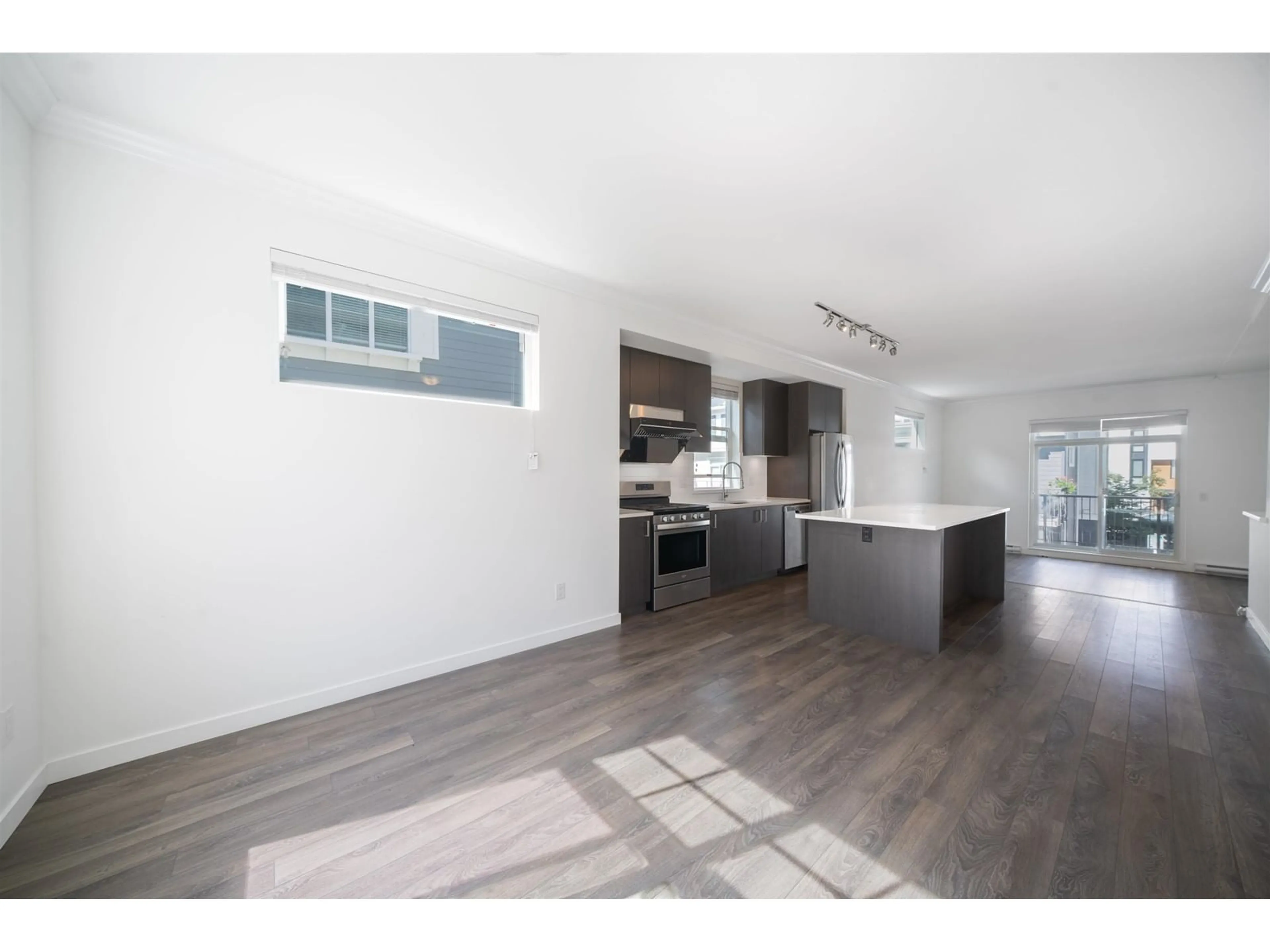 Open concept kitchen, wood/laminate floor for 67 16678 25 AVENUE, Surrey British Columbia V3Z0Z2