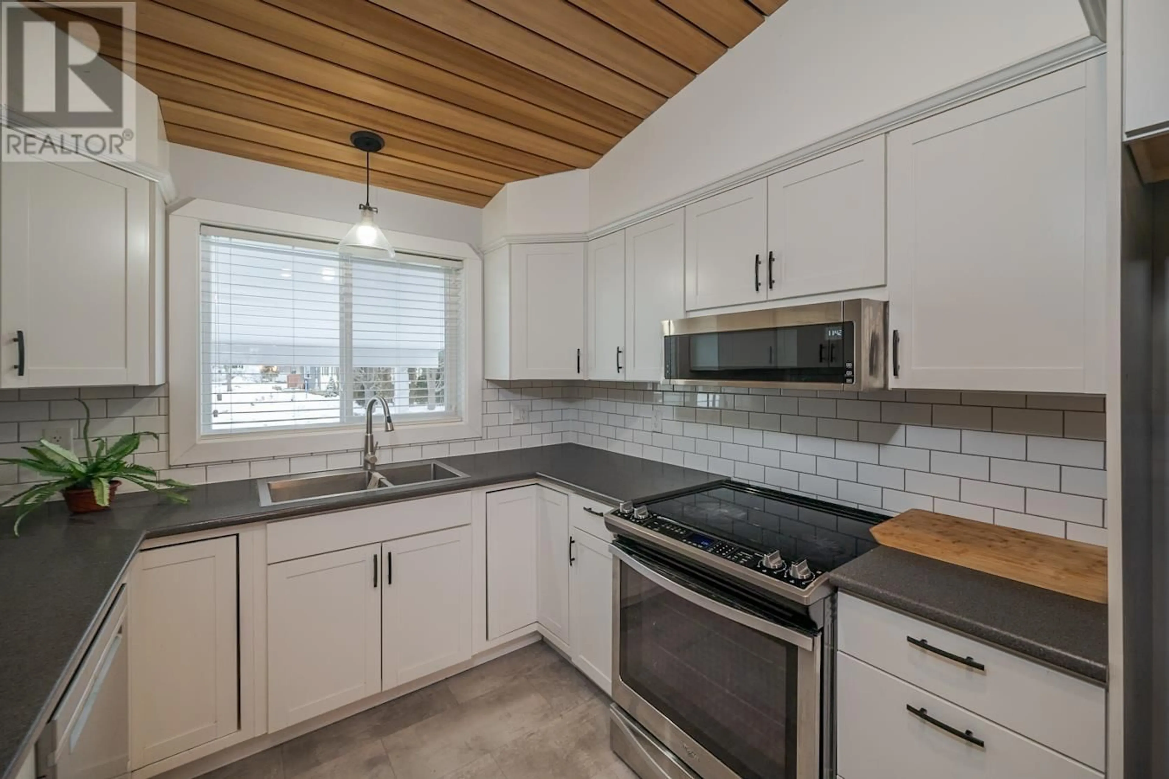 Open concept kitchen, ceramic/tile floor for 6184 TRENT DRIVE, Prince George British Columbia V2N2G5