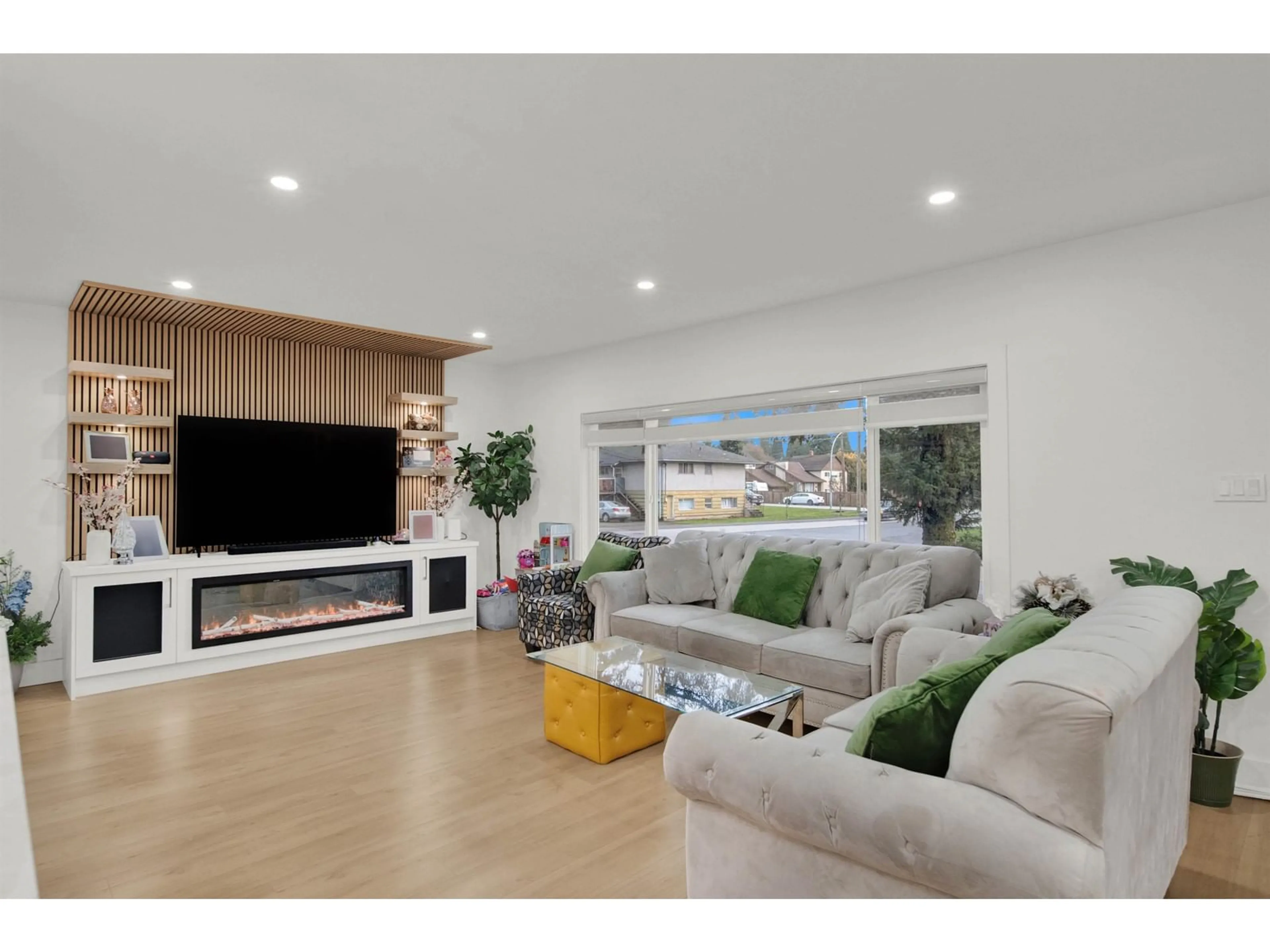 Living room with furniture, wood/laminate floor for 13011 102 AVENUE, Surrey British Columbia V3T1N3