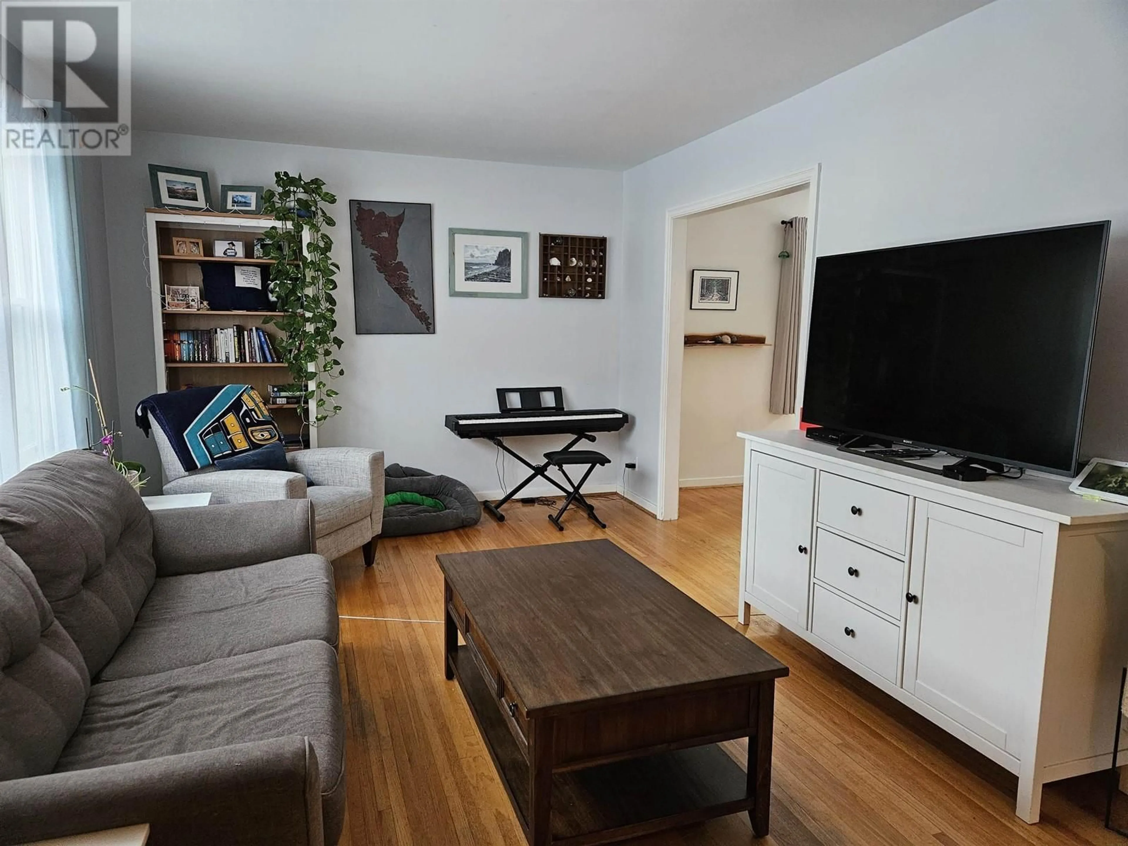 Living room with furniture, wood/laminate floor for 2263 HEMLOCK STREET, Terrace British Columbia V8G5B2