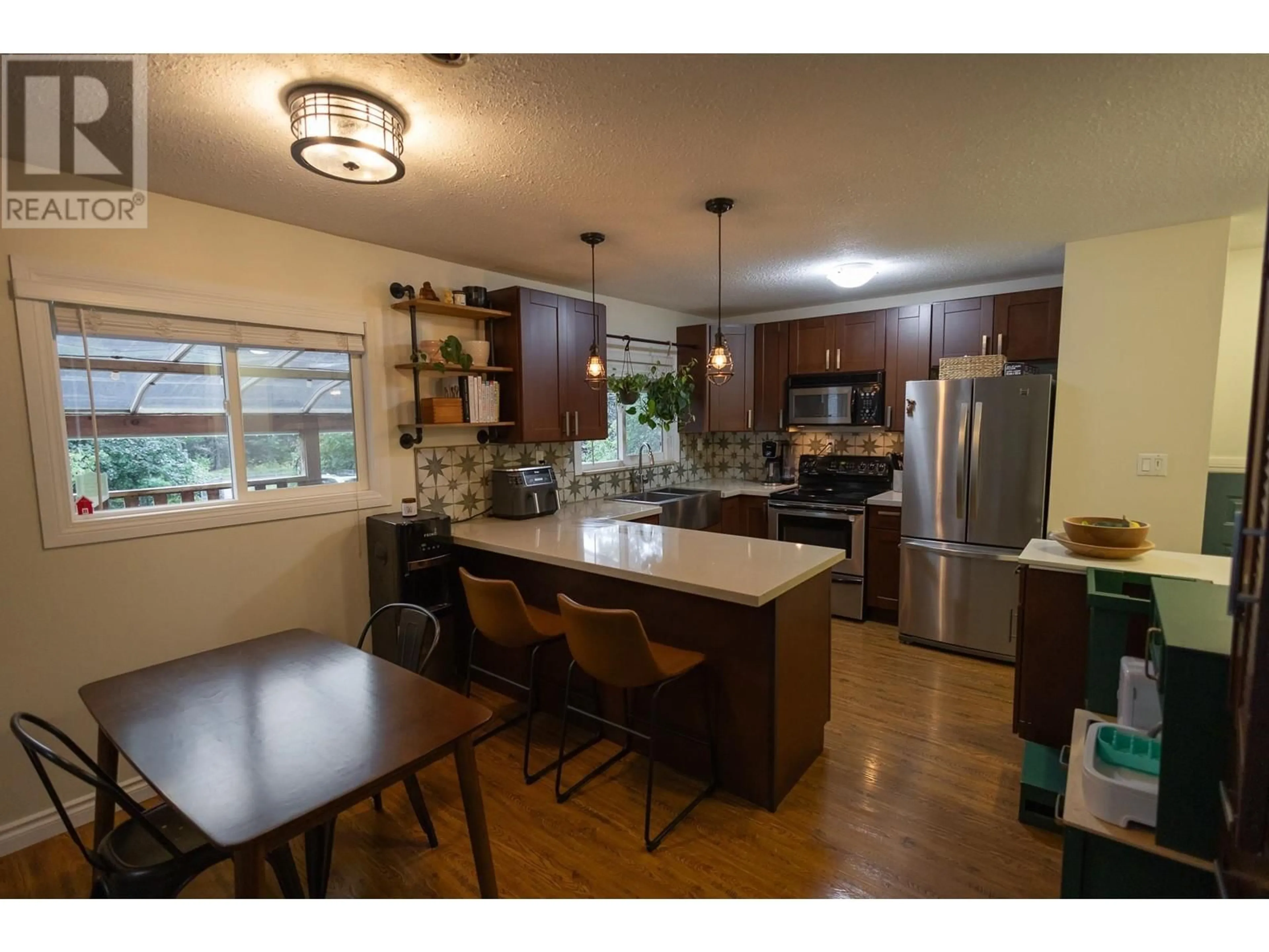 Open concept kitchen, wood/laminate floor for 548 KALUM LAKE ROAD, Terrace British Columbia V8G0C1