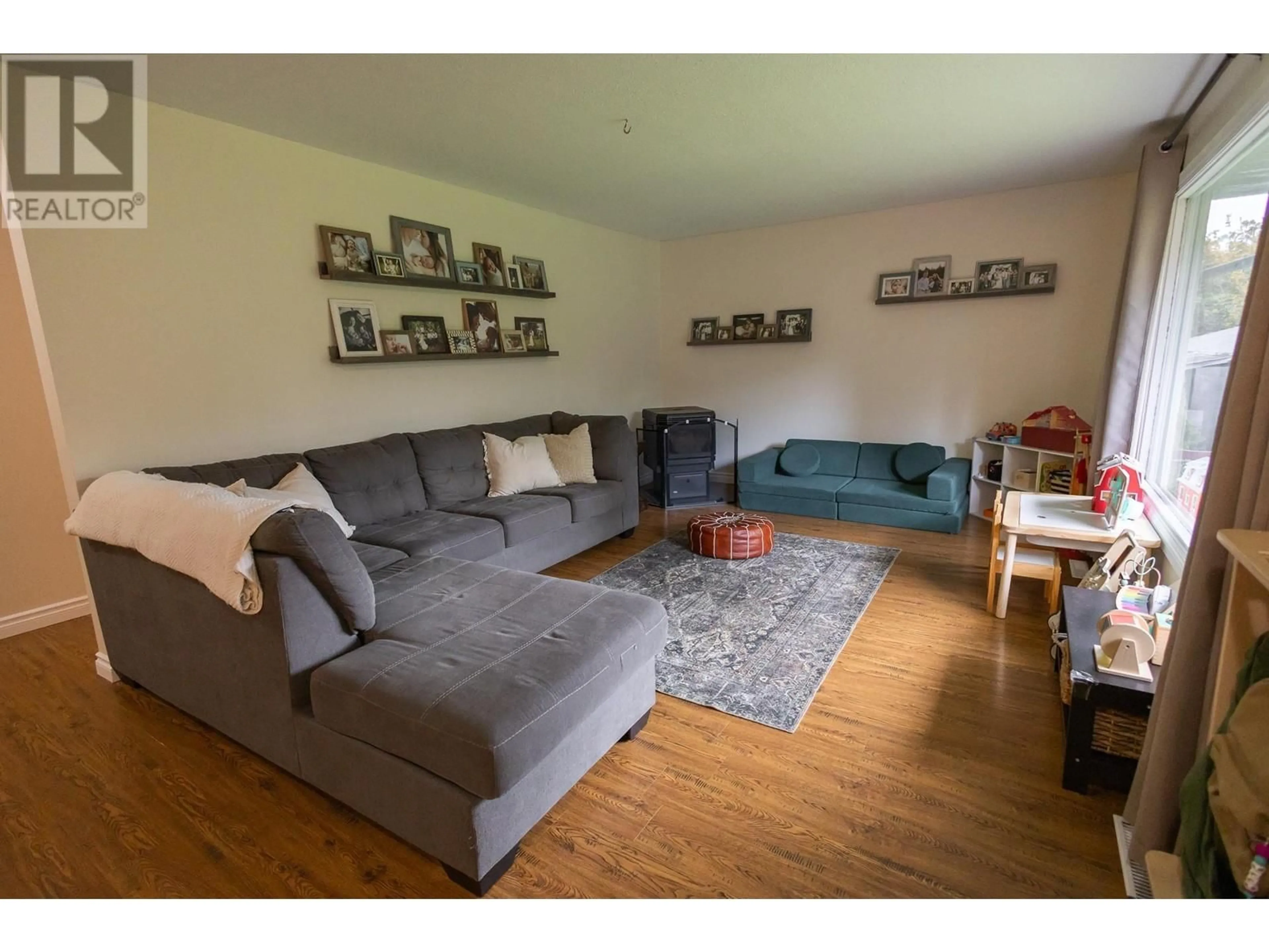 Living room with furniture, wood/laminate floor for 548 KALUM LAKE ROAD, Terrace British Columbia V8G0C1