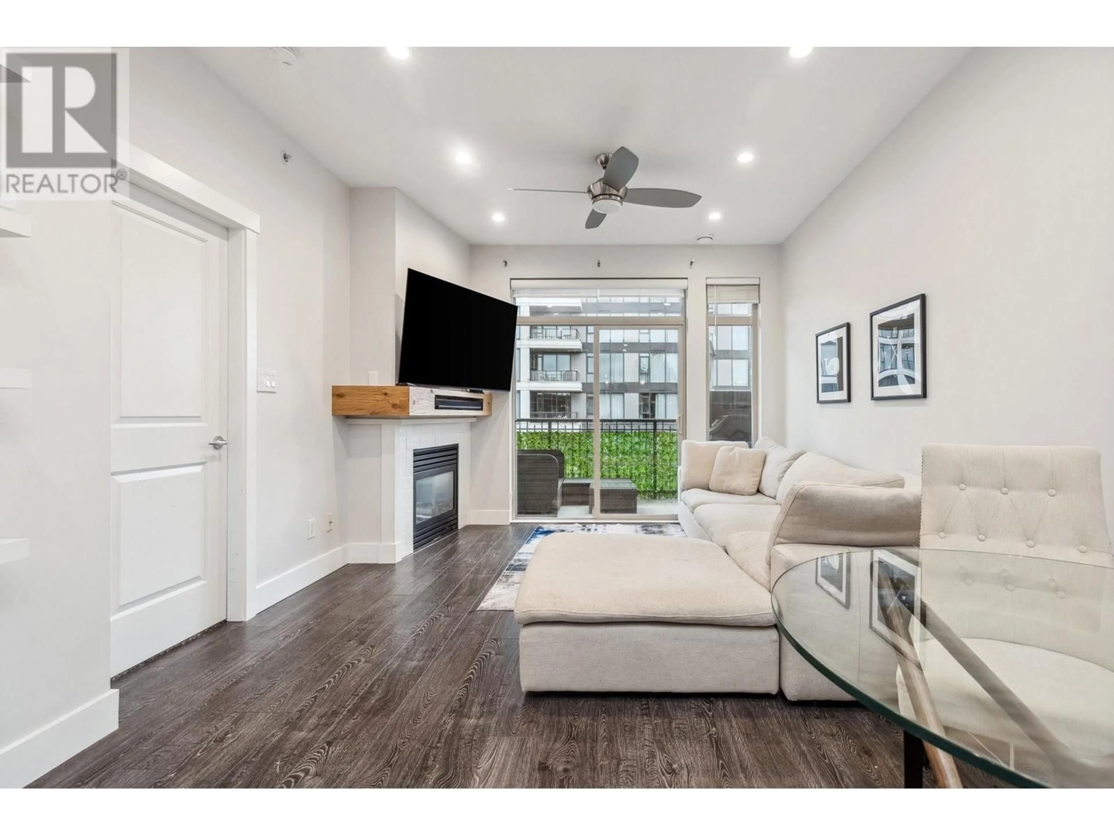 Living room with furniture, wood/laminate floor for 403 2280 WESBROOK MALL, Vancouver British Columbia V6T2K3