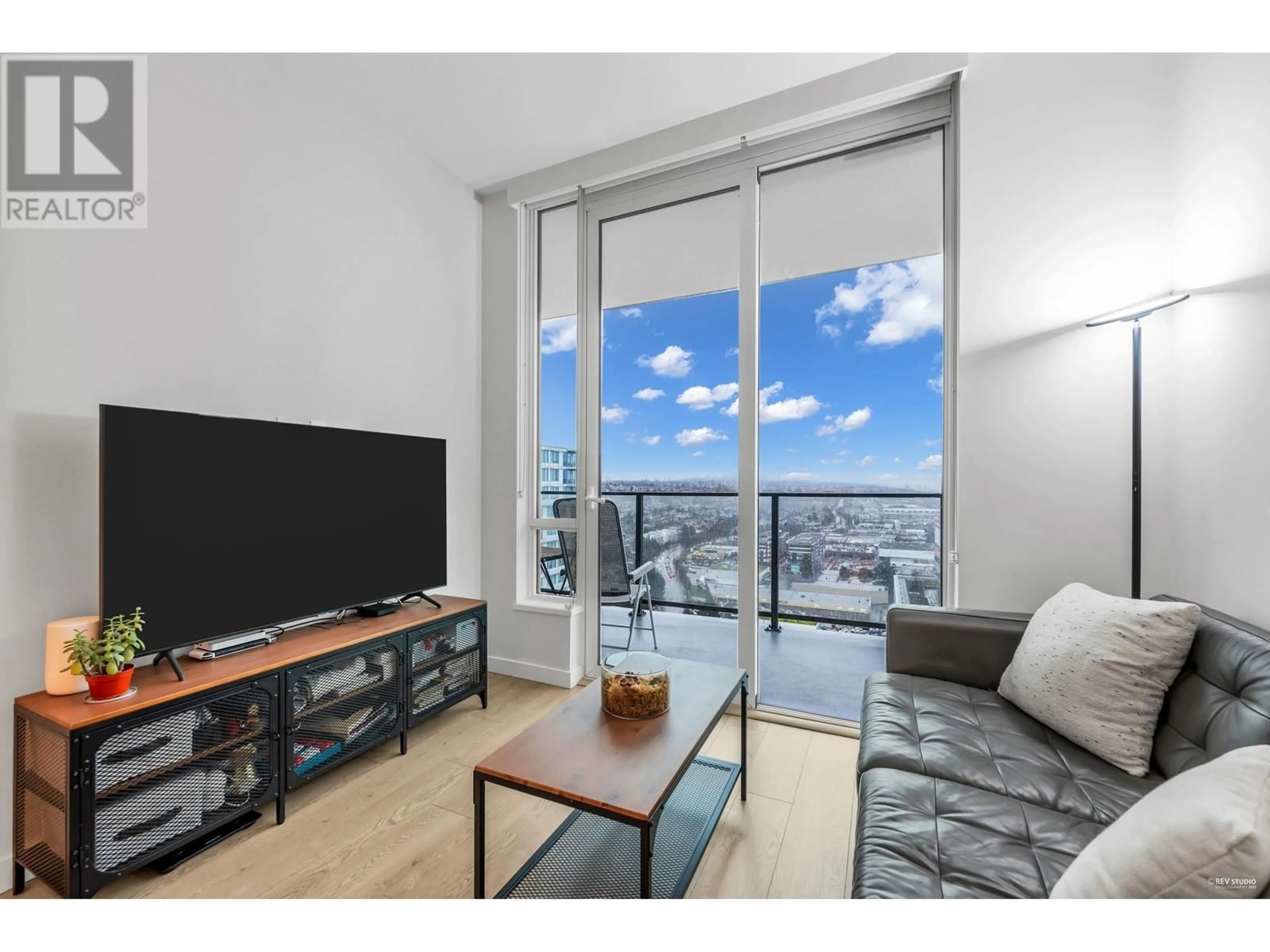 Living room with furniture, wood/laminate floor for 3006 8189 CAMBIE STREET, Vancouver British Columbia V6P0G6