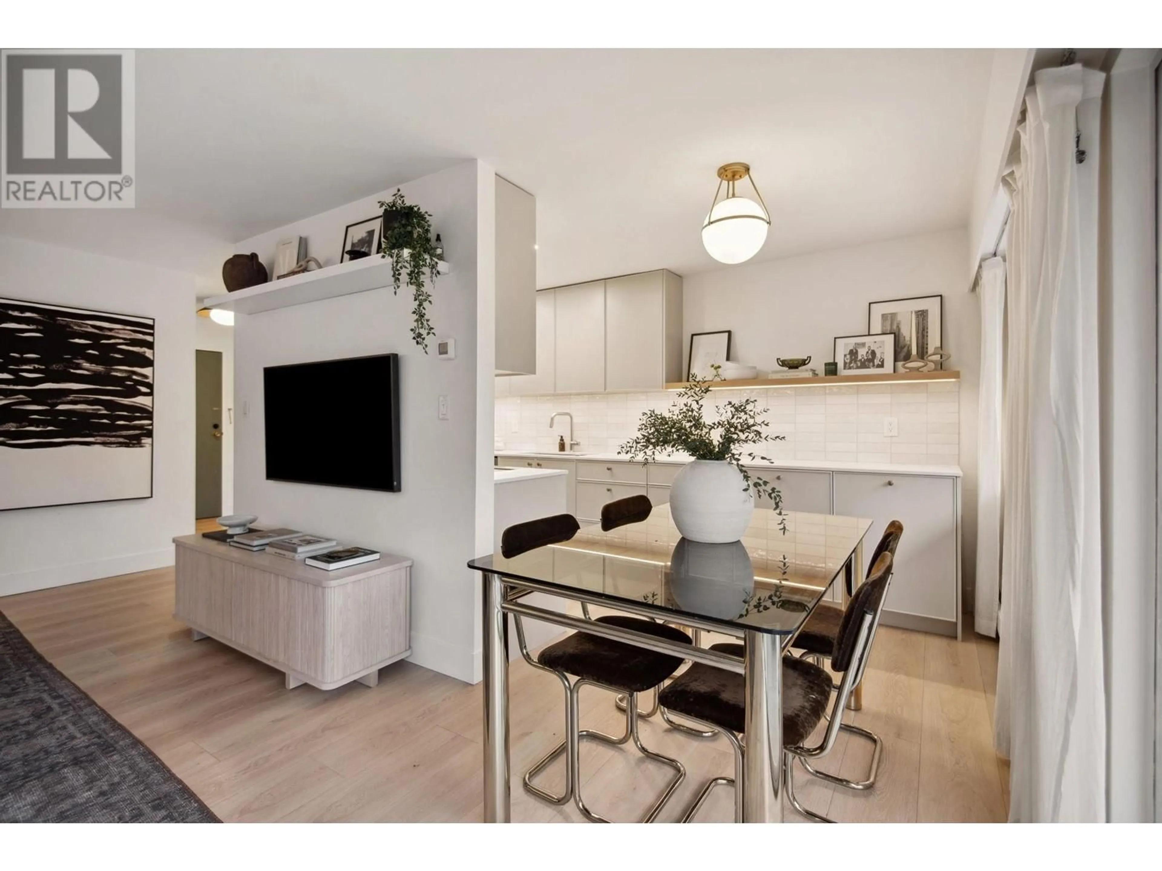 Open concept kitchen, wood/laminate floor for 209 3080 LONSDALE AVENUE, North Vancouver British Columbia V7N3J5