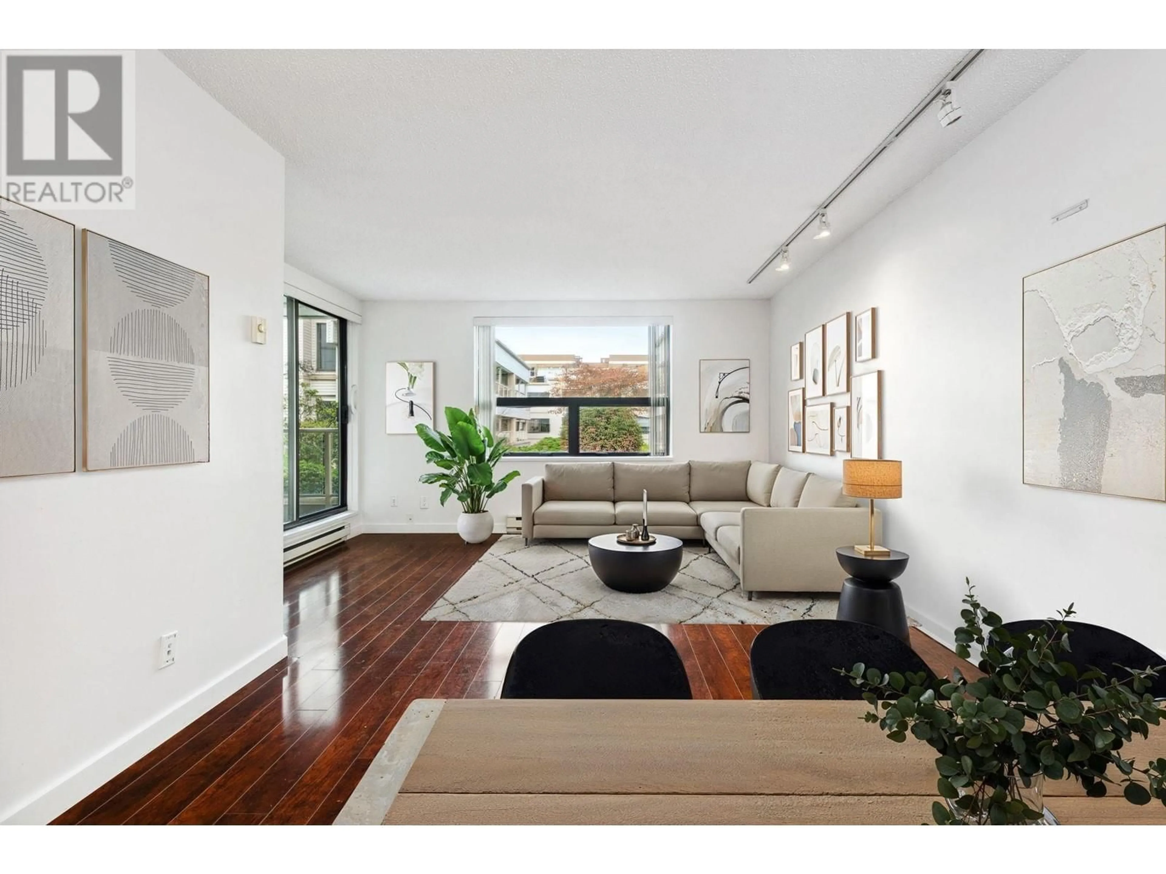 Living room with furniture, wood/laminate floor for 212 1350 COMOX STREET, Vancouver British Columbia V6E4E1