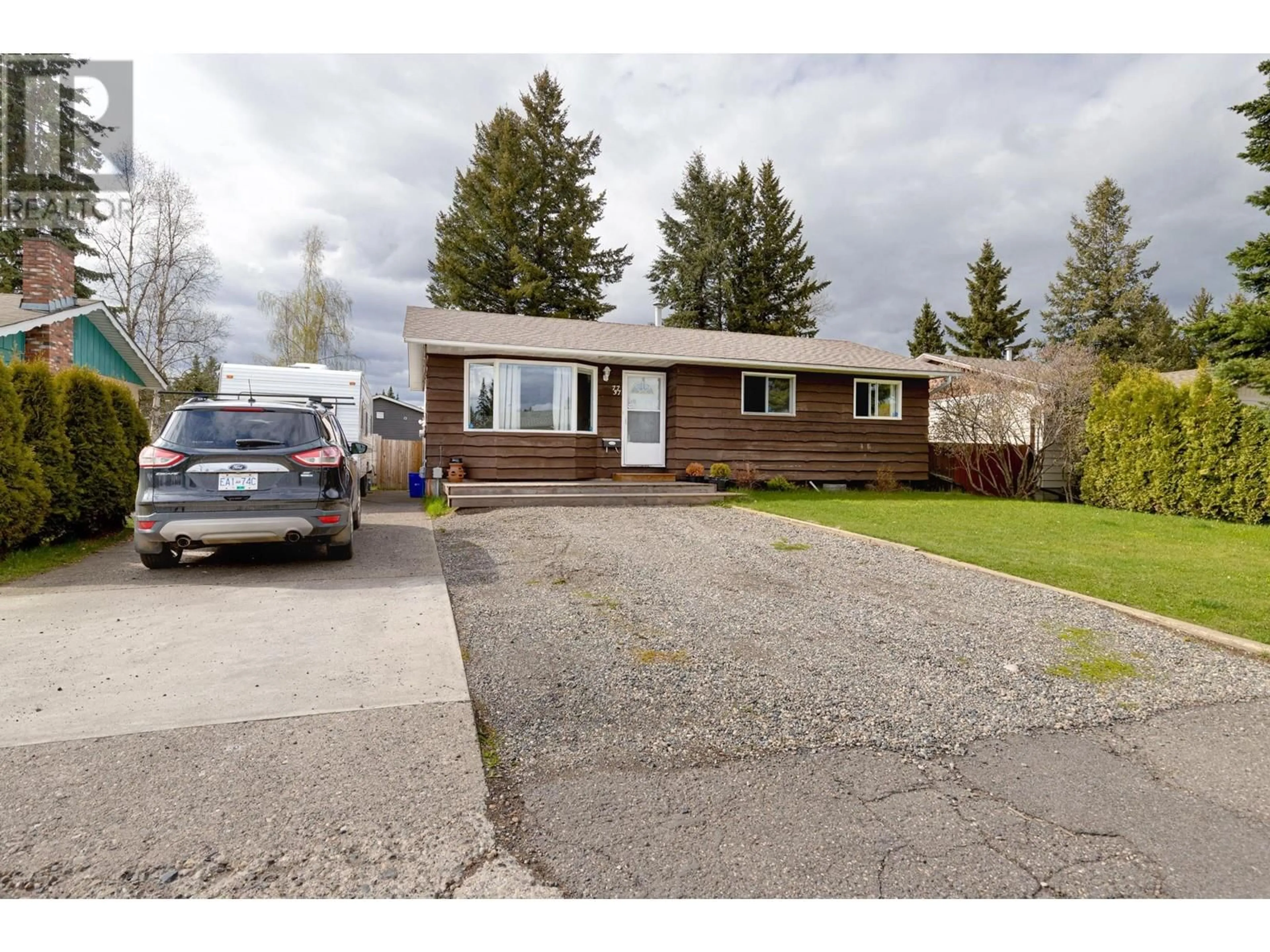 Home with vinyl exterior material, street for 7737 LOYOLA DRIVE, Prince George British Columbia V2N2W9