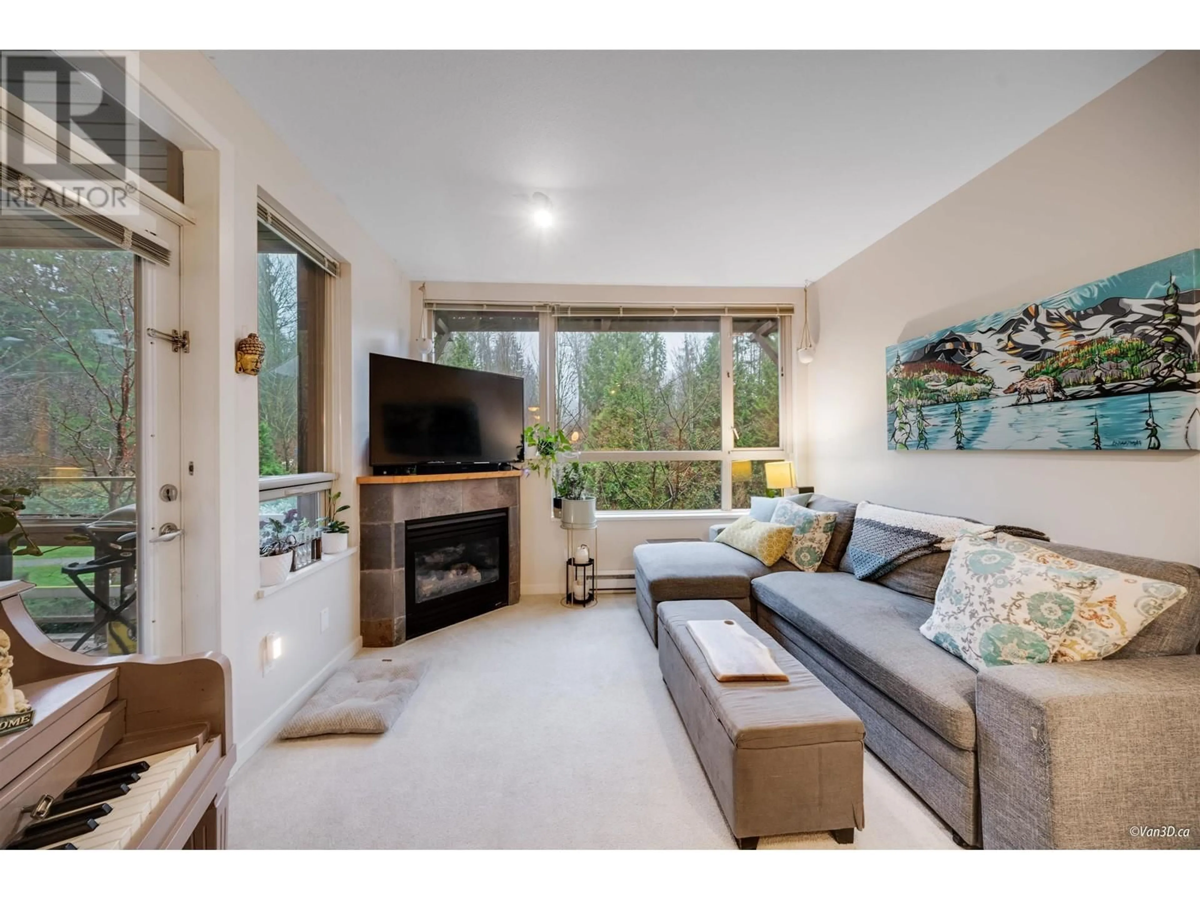 Living room with furniture, wood/laminate floor for 306 560 RAVEN WOODS DRIVE, North Vancouver British Columbia V7G2T3