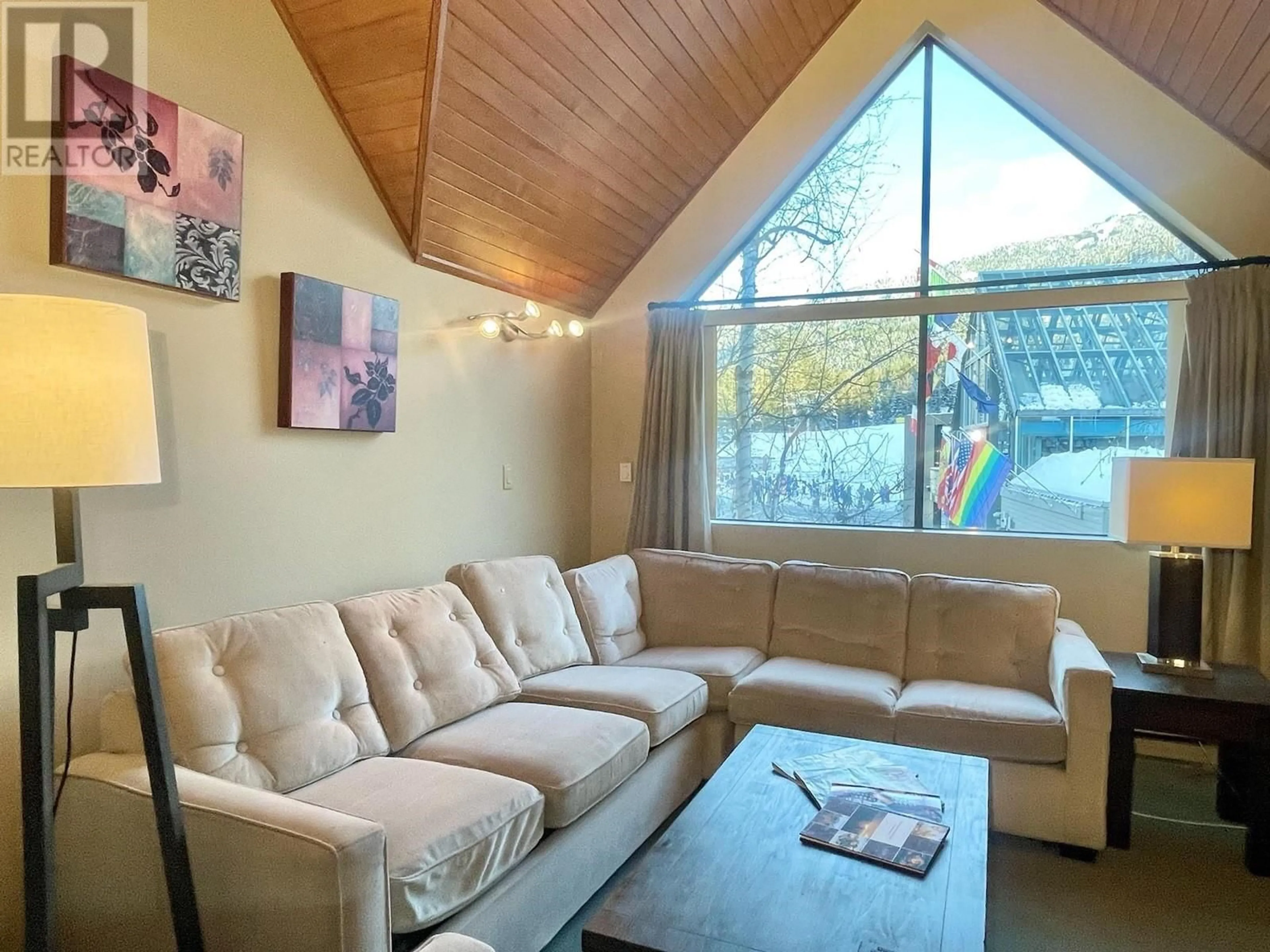 Living room with furniture, wood/laminate floor for Wk 13 906-4293 MOUNTAIN SQUARE, Whistler British Columbia V8E1B8