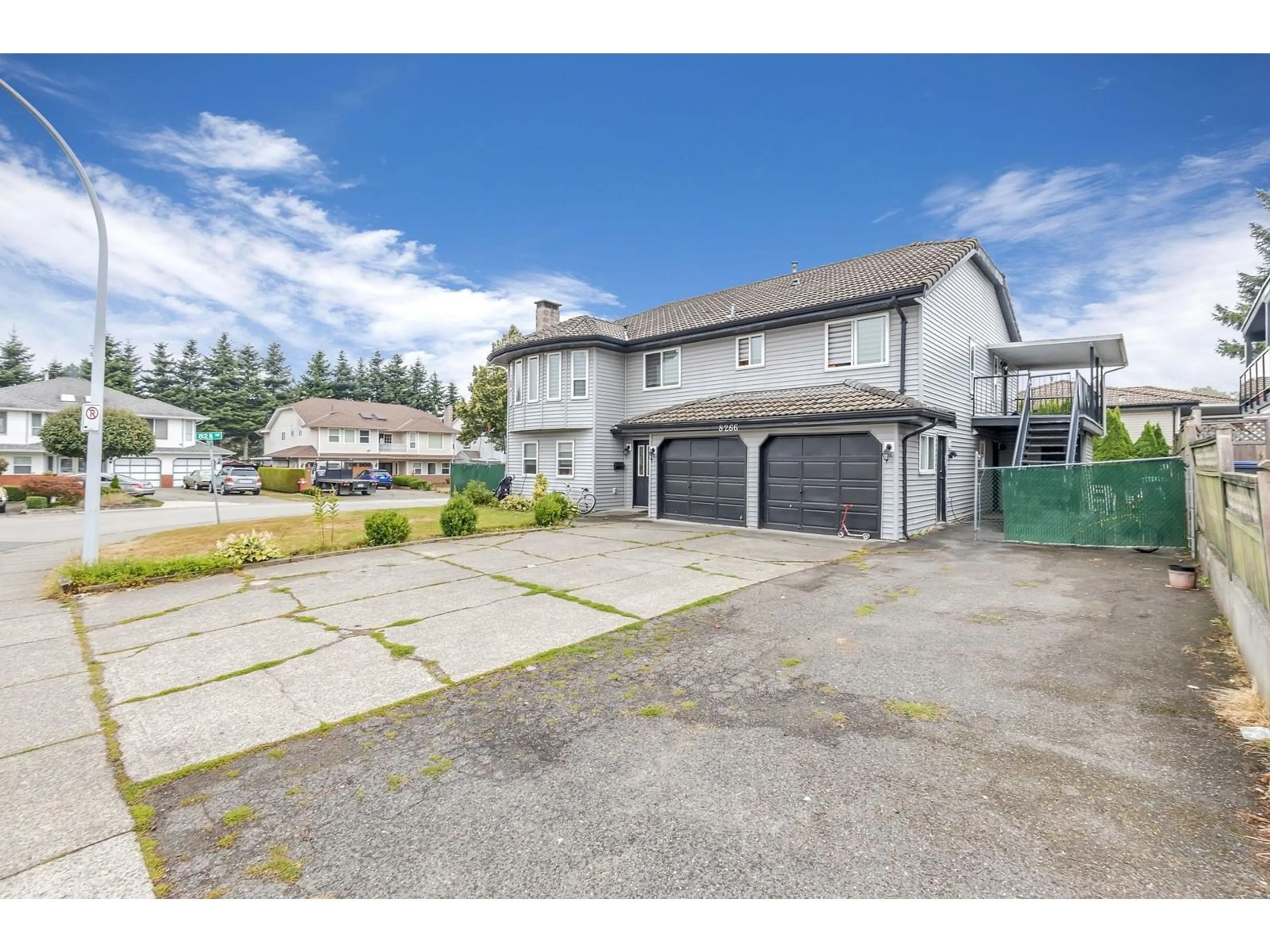 A pic from outside/outdoor area/front of a property/back of a property/a pic from drone, street for 8266 132A STREET, Surrey British Columbia V3W8Y6