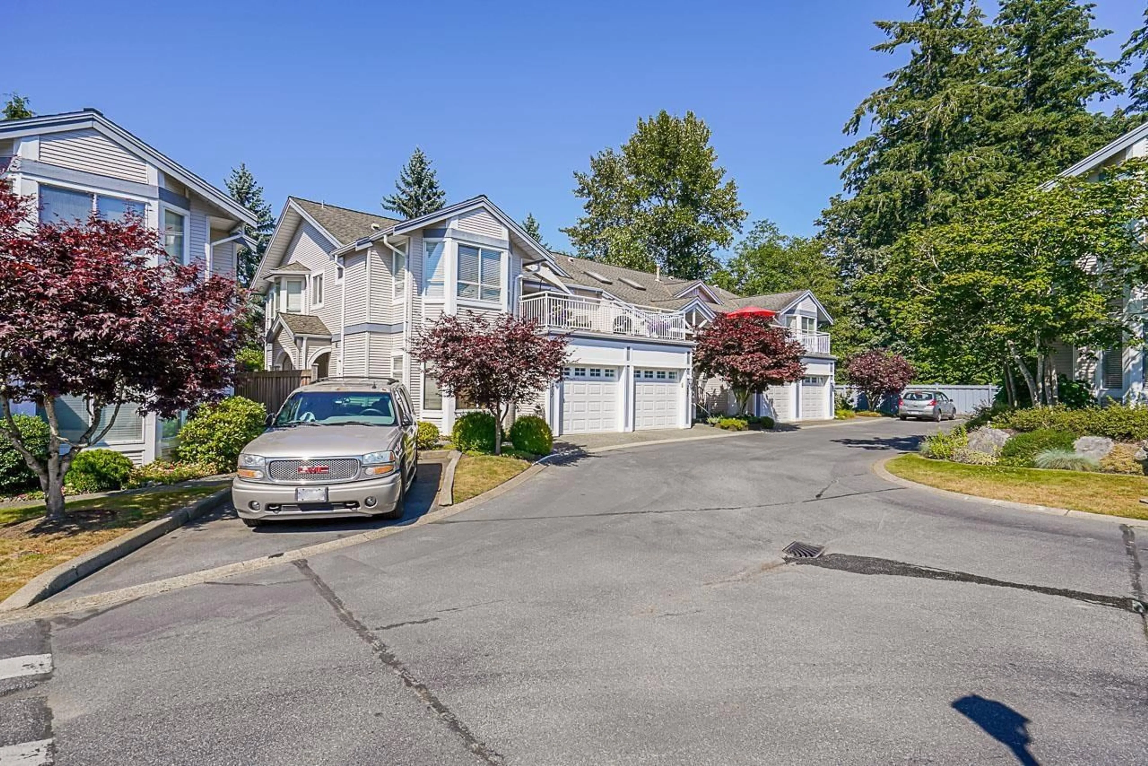 A pic from outside/outdoor area/front of a property/back of a property/a pic from drone, street for 107 9072 FLEETWOOD WAY, Surrey British Columbia V3R0M6