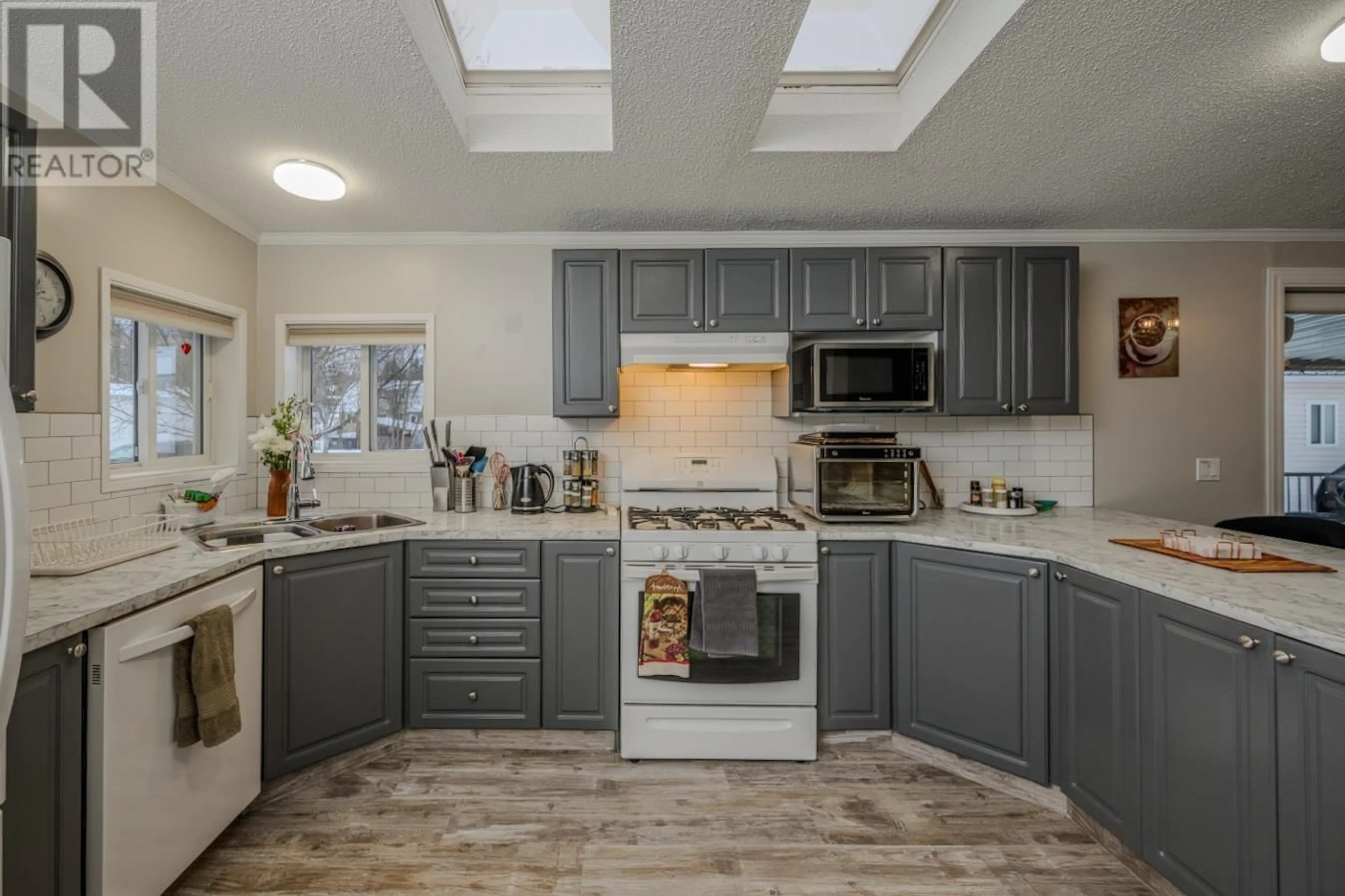 Open concept kitchen, unknown for 3 7100 ALDEEN ROAD, Prince George British Columbia V2N5R5