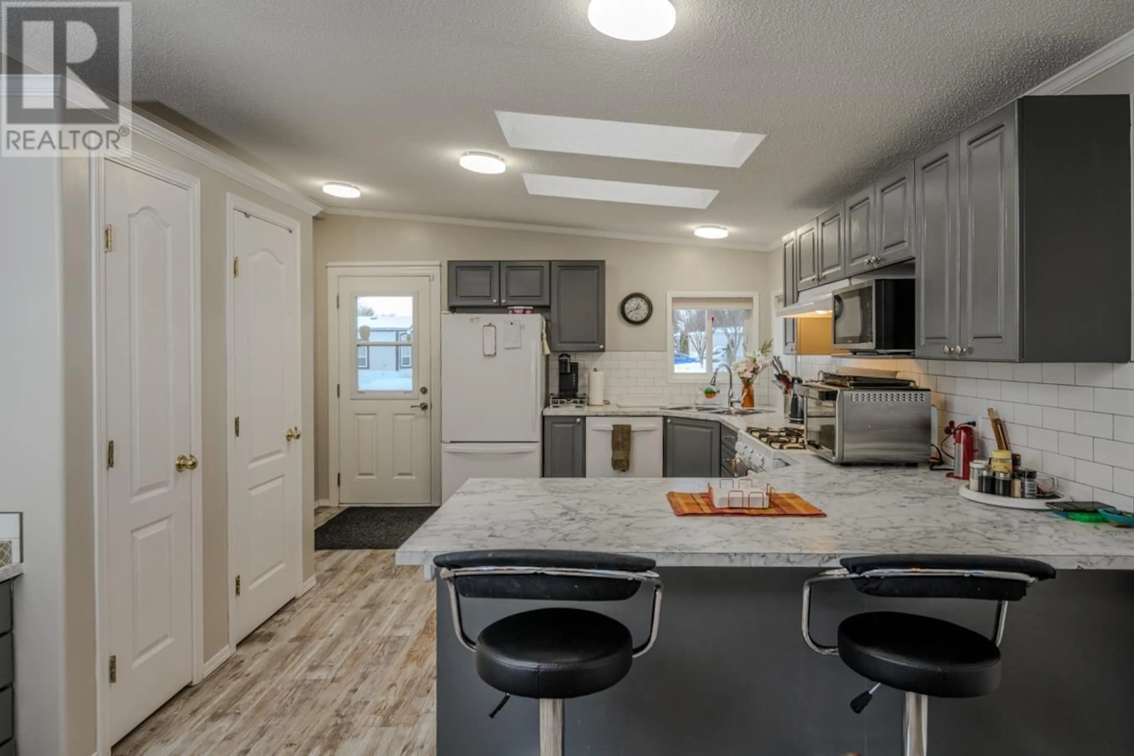 Open concept kitchen, ceramic/tile floor for 3 7100 ALDEEN ROAD, Prince George British Columbia V2N5R5