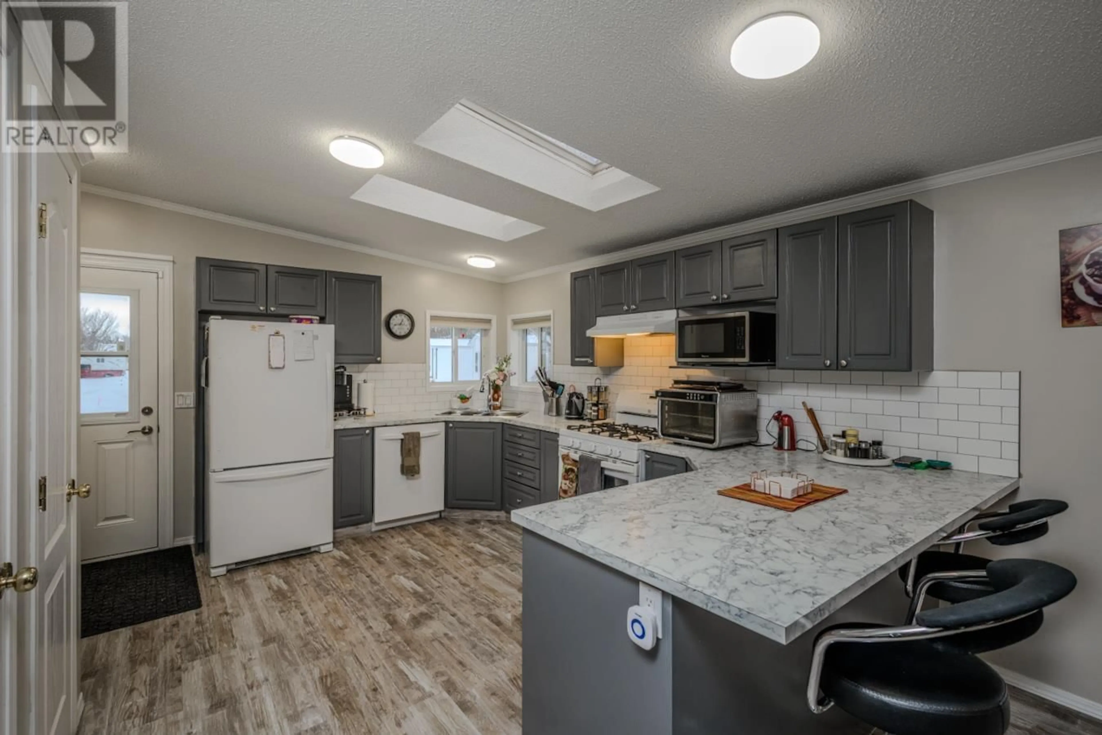 Open concept kitchen, unknown for 3 7100 ALDEEN ROAD, Prince George British Columbia V2N5R5