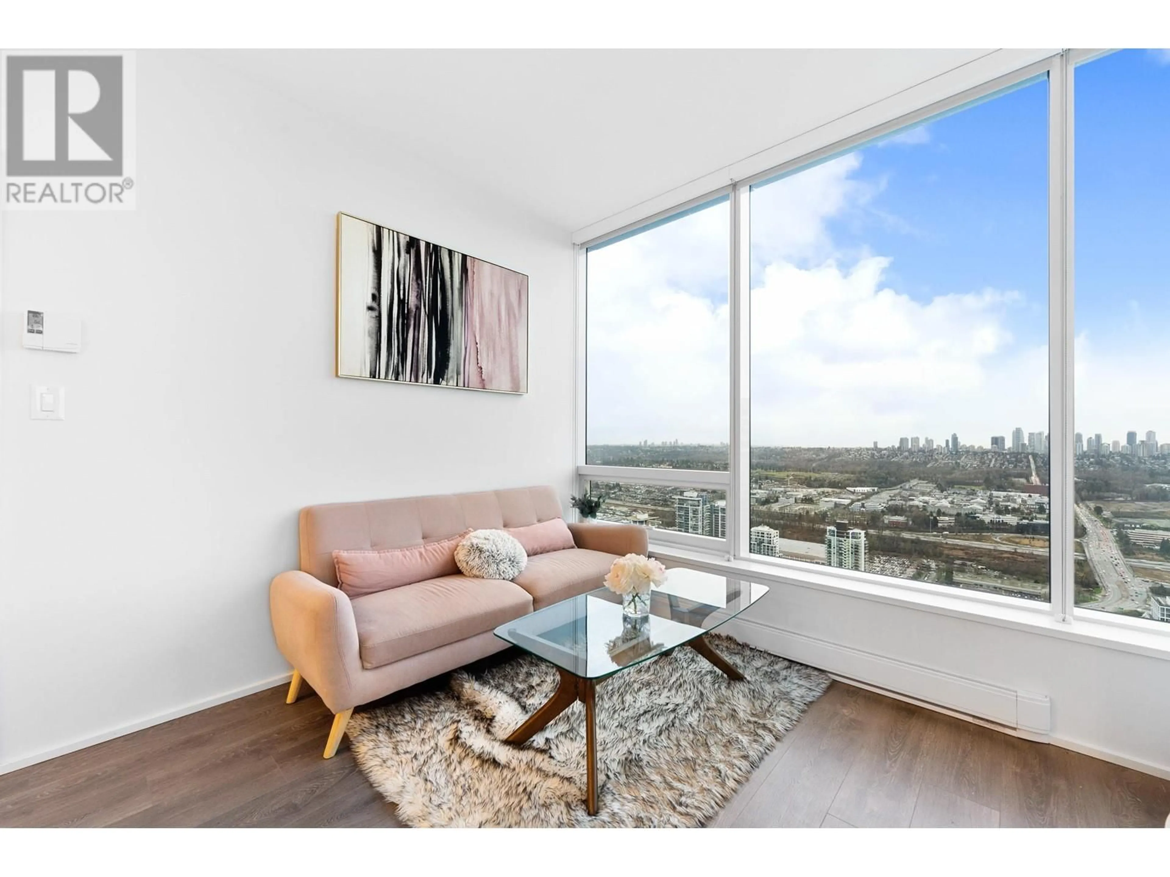 Living room with furniture, wood/laminate floor for 5507 4510 HALIFAX WAY, Burnaby British Columbia V5C0K4