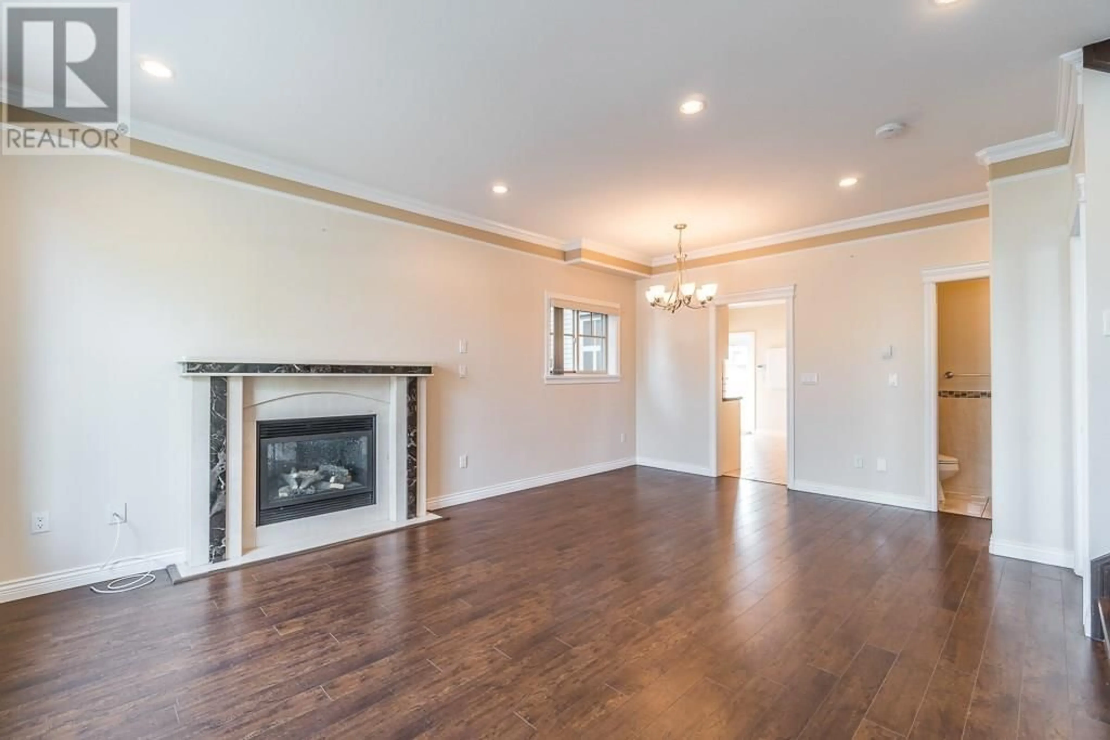 Living room with furniture, wood/laminate floor for 7734 16TH AVENUE, Burnaby British Columbia V3N1P9